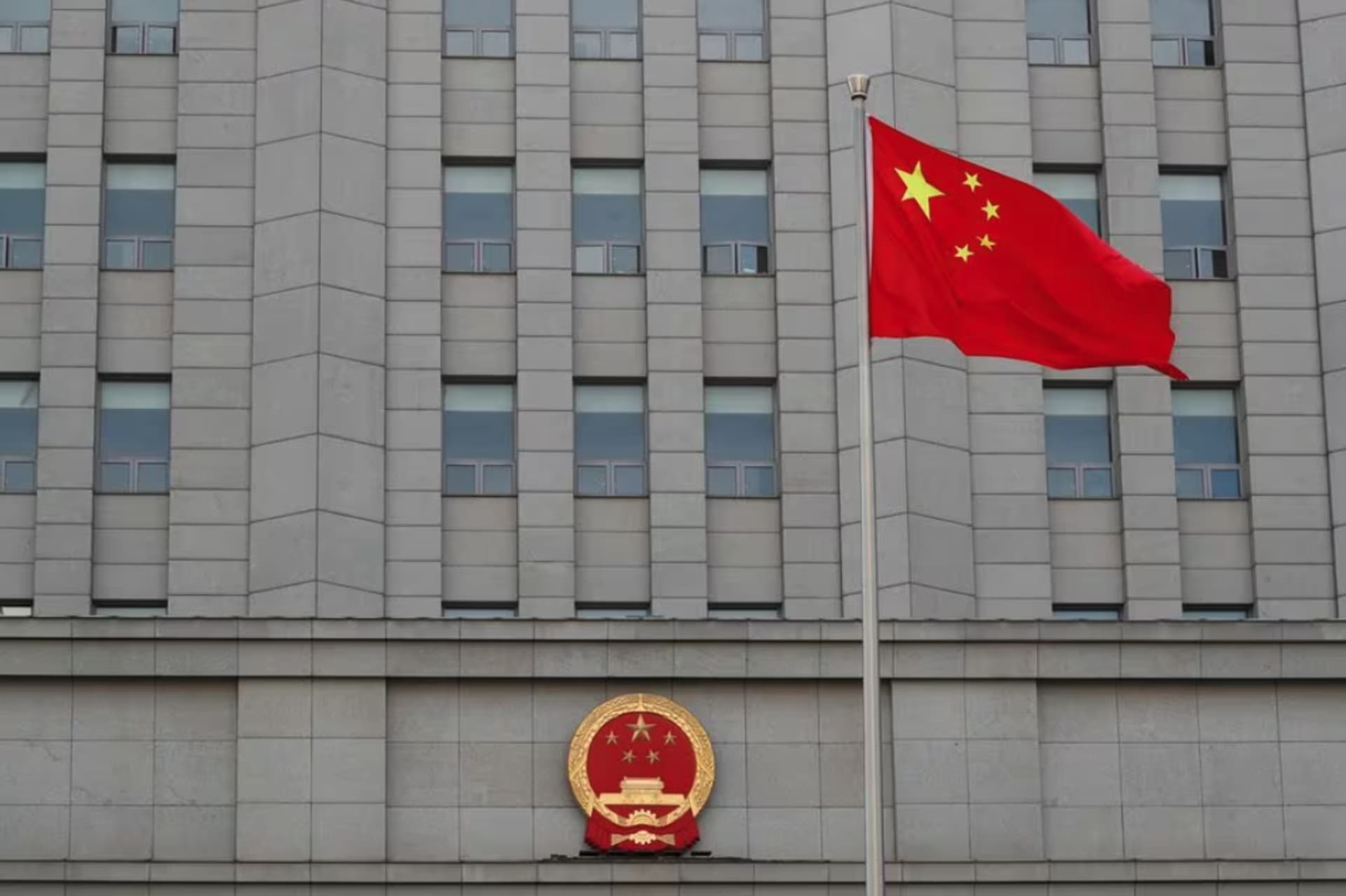 <p>A Chinese flag waves outside Beijing No. 2 Intermediate People’s Court in Beijing, China.</p>
