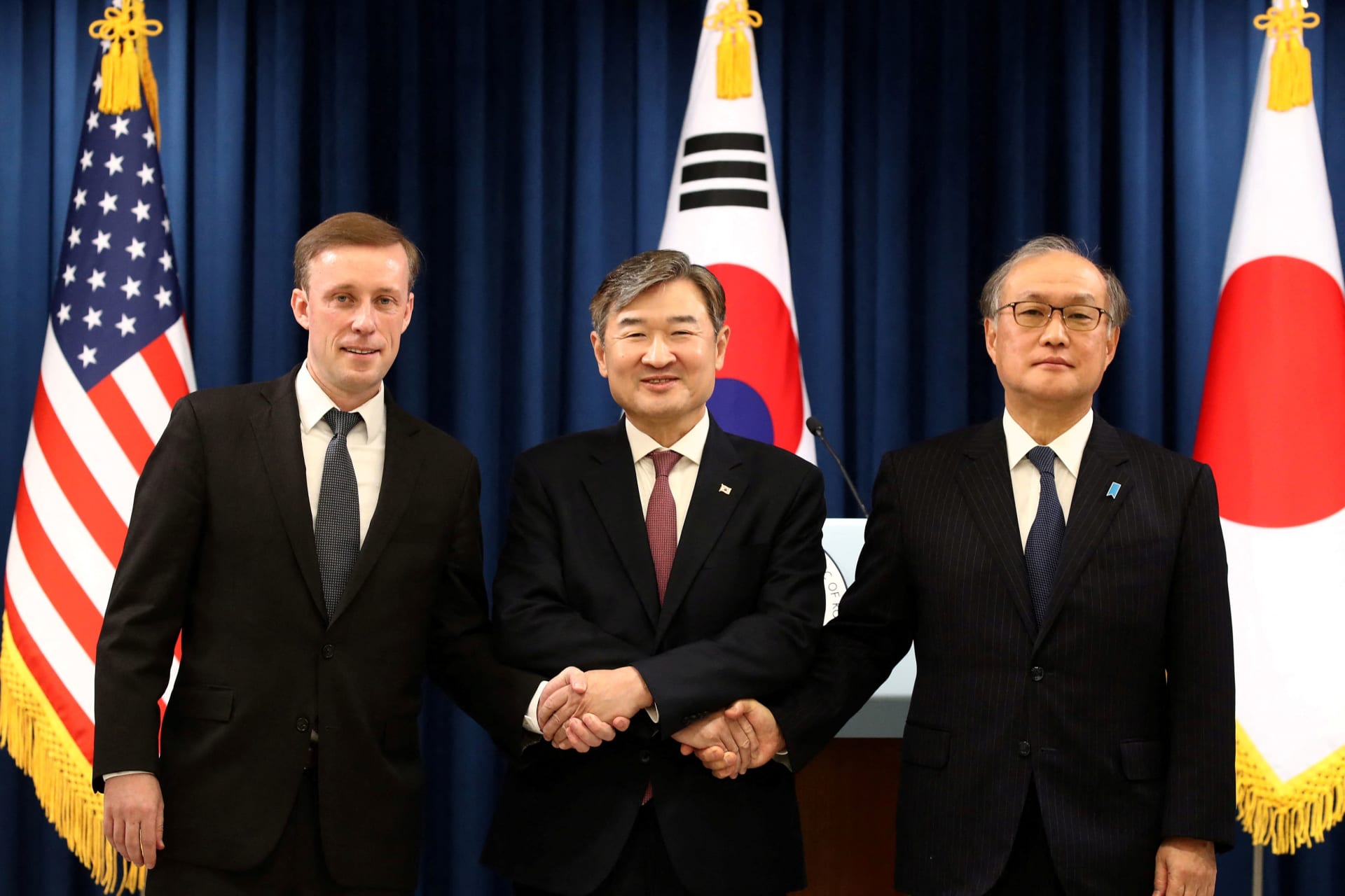 <p>U.S. National Security Advisor Jake Sullivan, South Korea’s National Security Adviser Cho Tae-yong, and Japan’s National Security Secretariat Secretary-General Takeo Akiba shake hands after their joint press conference on December 9, 2023.</p>
