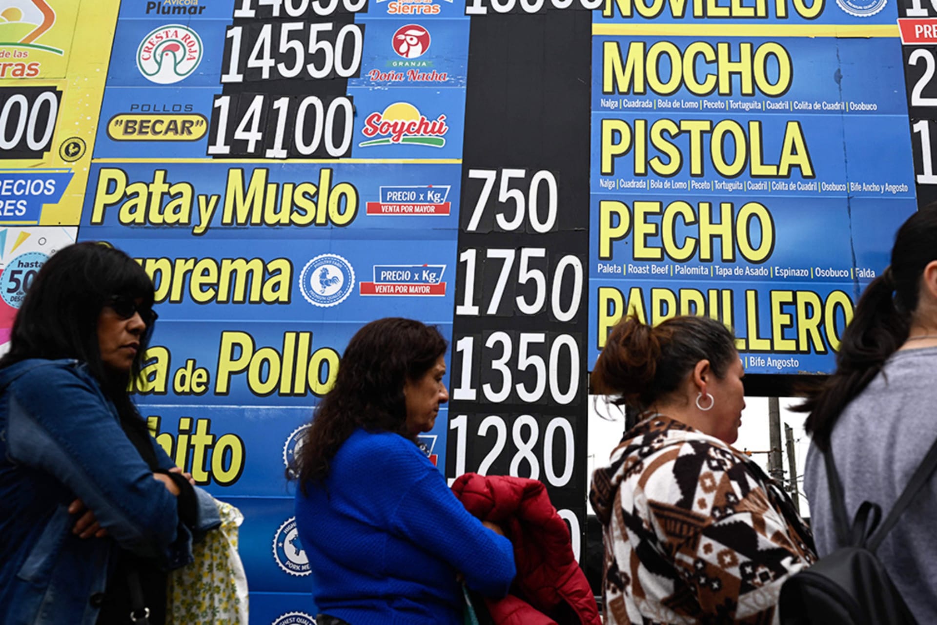 <p>People line up in front of a butcher shop in Buenos Aires, Argentina.</p>
