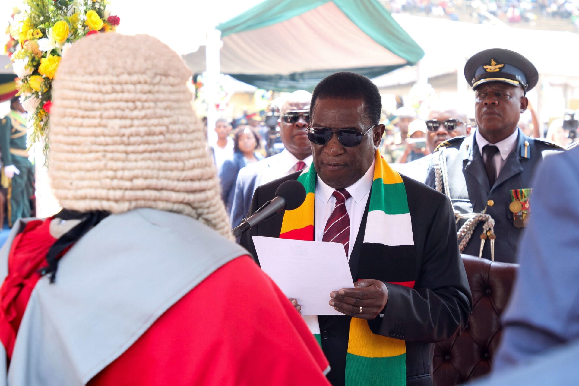 <p>Zimbabwe President Emmerson Mnangagwa takes an oath of office during his inauguration at the National Sports Stadium in Harare, Zimbabwe on September 4, 2023. </p>
