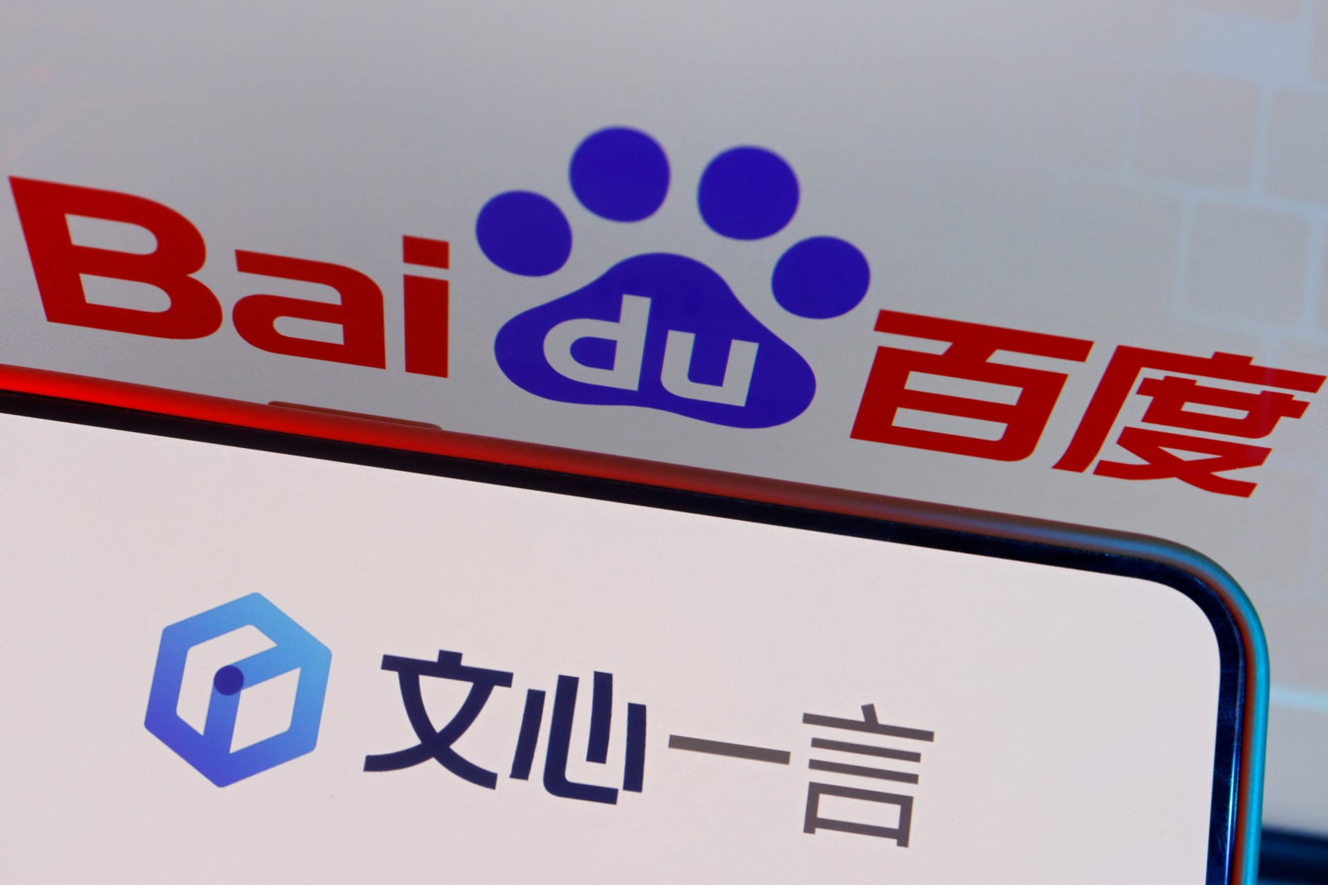 <p>The logo of Baidu’s AI chatbot Ernie Bot is displayed near a screen showing the Baidu logo, in this illustration picture taken June 28, 2023</p>
