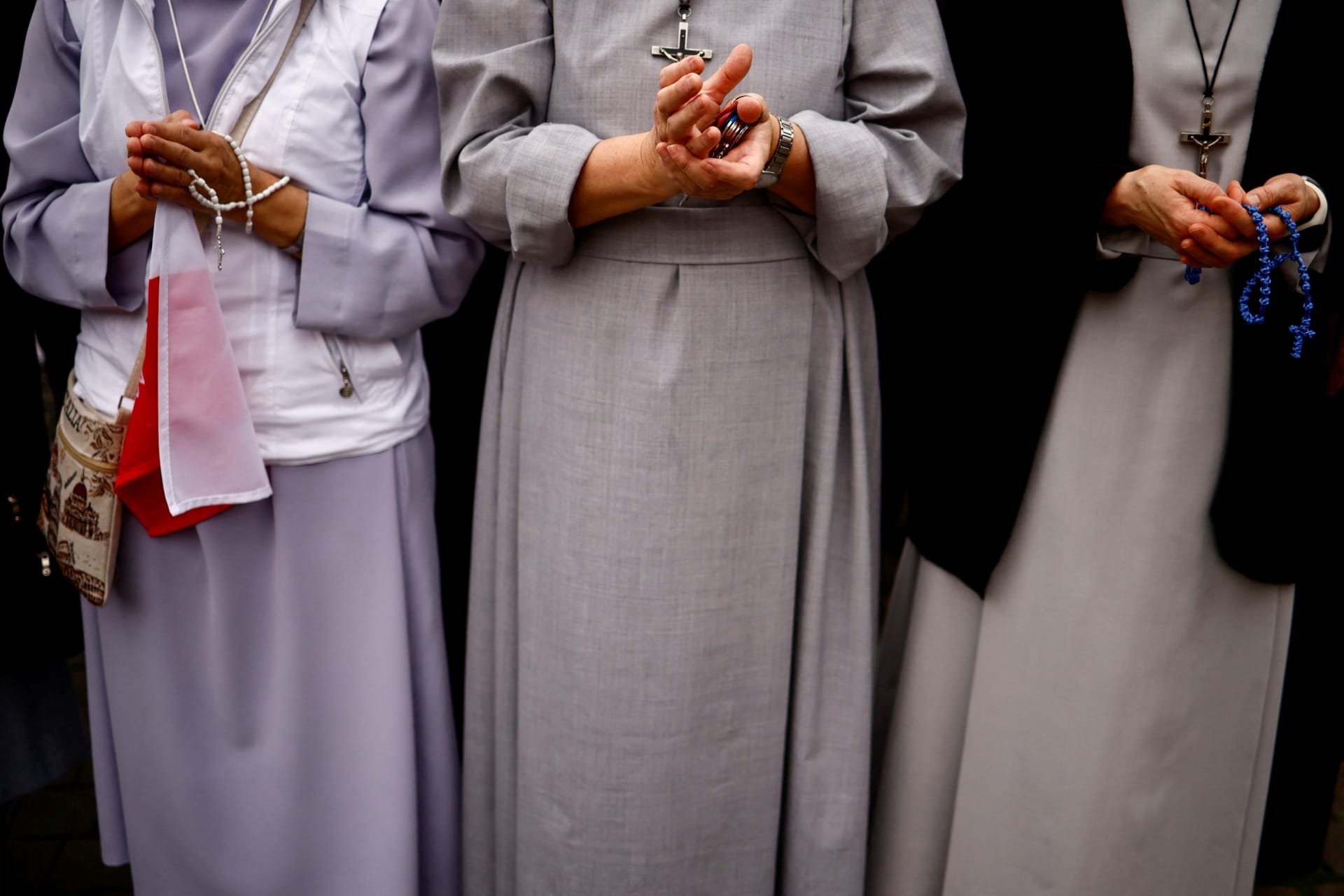 <p>Nuns hold rosaries as Pope Francis celebrates the Angelus prayer from a window for All Saints Day at Saint Peter’s Square at the Vatican, November 1, 2023.</p>
