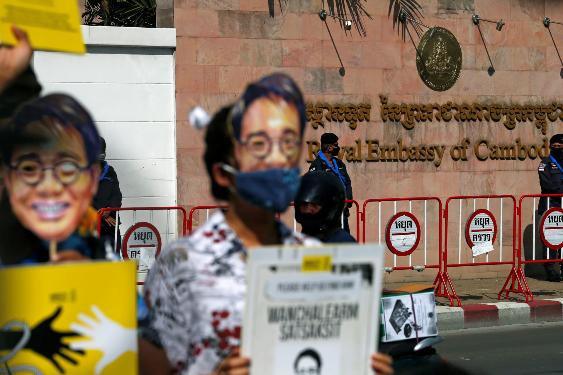 <p>Police officers stand guard during a protest on the six-month anniversary of pro-democracy activist Wanchalearm Satsaksit’s abduction, in front of the Cambodian embassy in Bangkok, Thailand, on December 3, 2020.</p>
