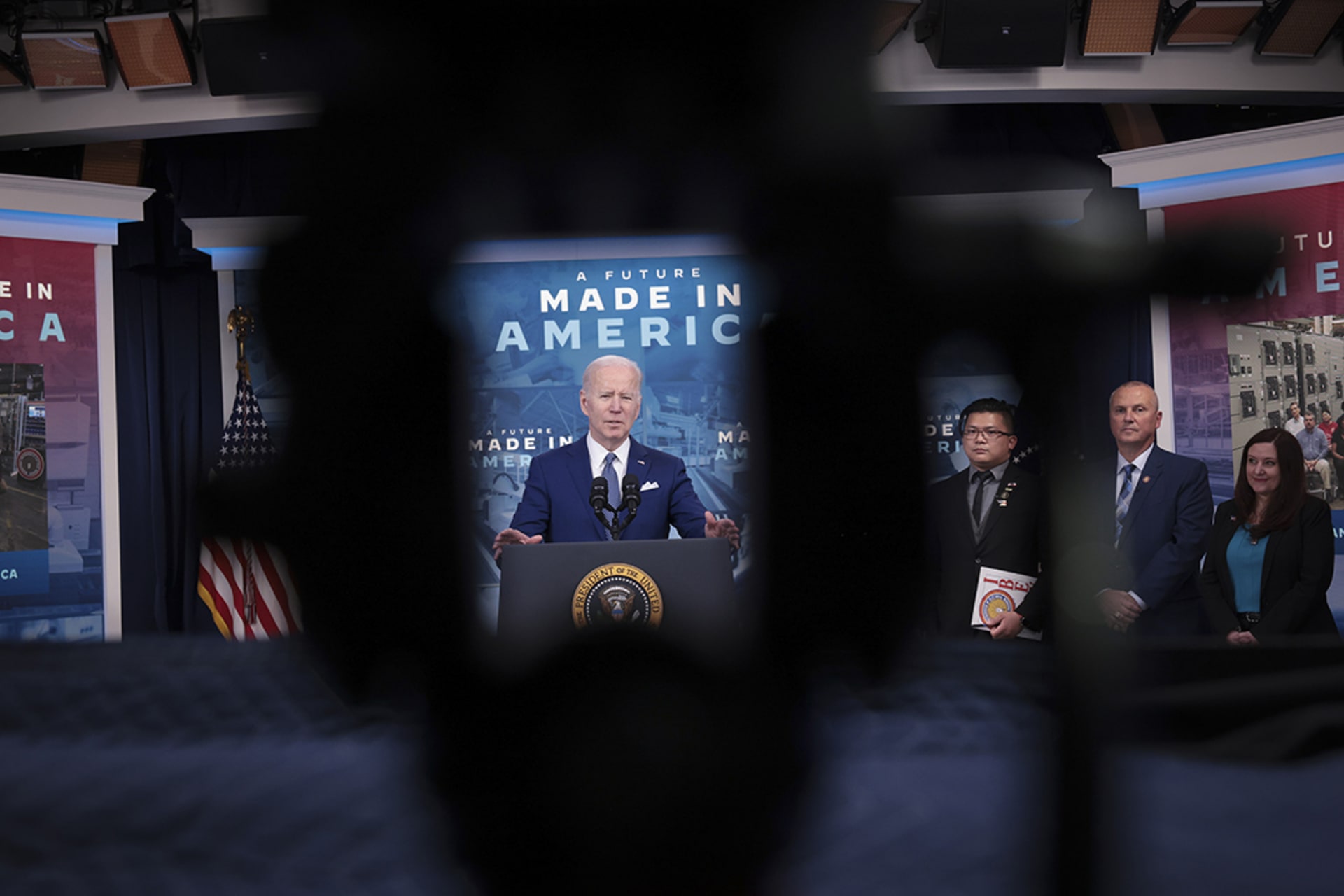 <p>U.S. President Joe Biden speaks with a Made in America poster displayed prominently in the background, highlighting his administration’s undertaking of industrial policy.</p>
