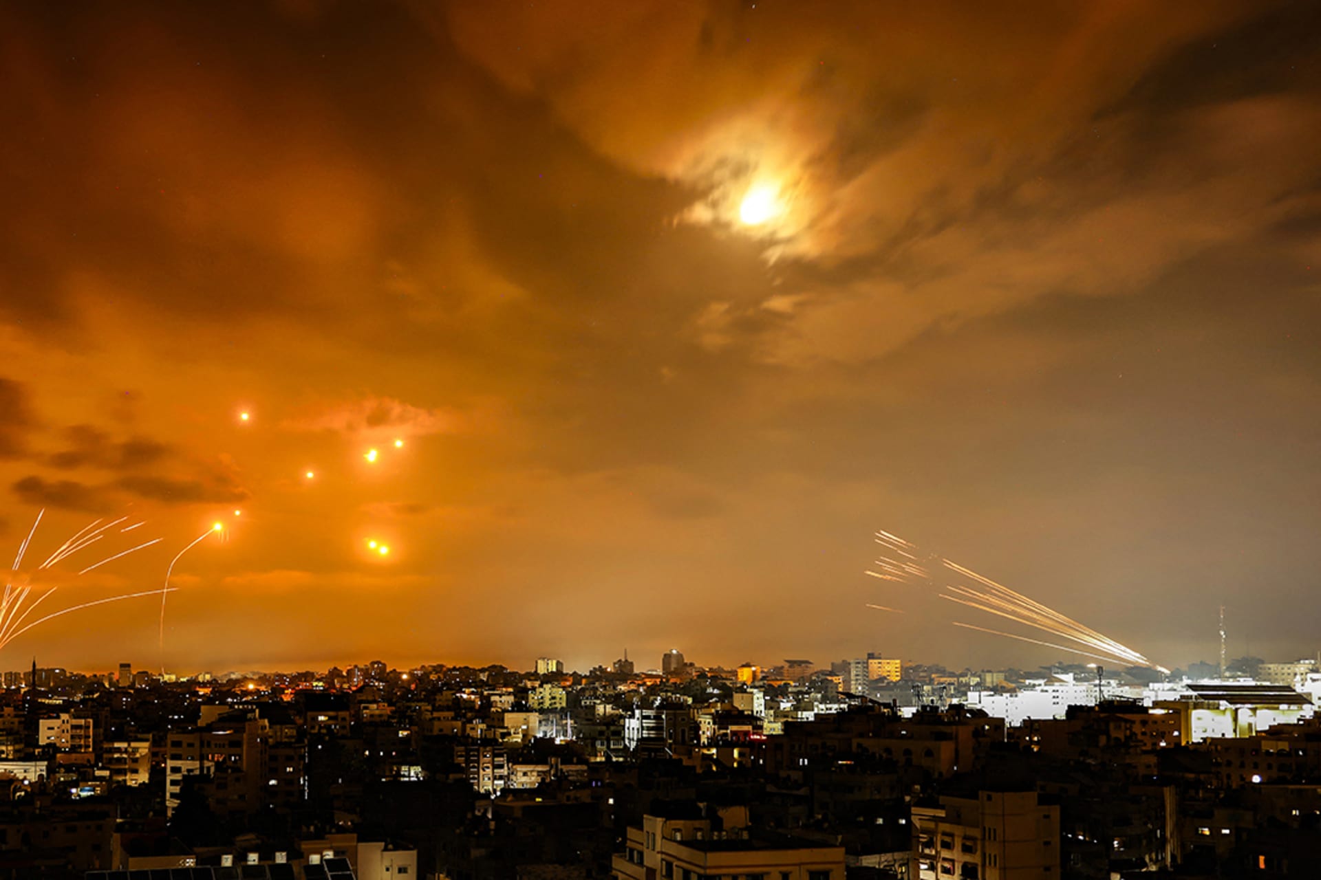 <p>Rockets fired from Gaza City are intercepted by the Israeli Iron Dome defense missile system in the early hours of October 8, 2023.</p>
