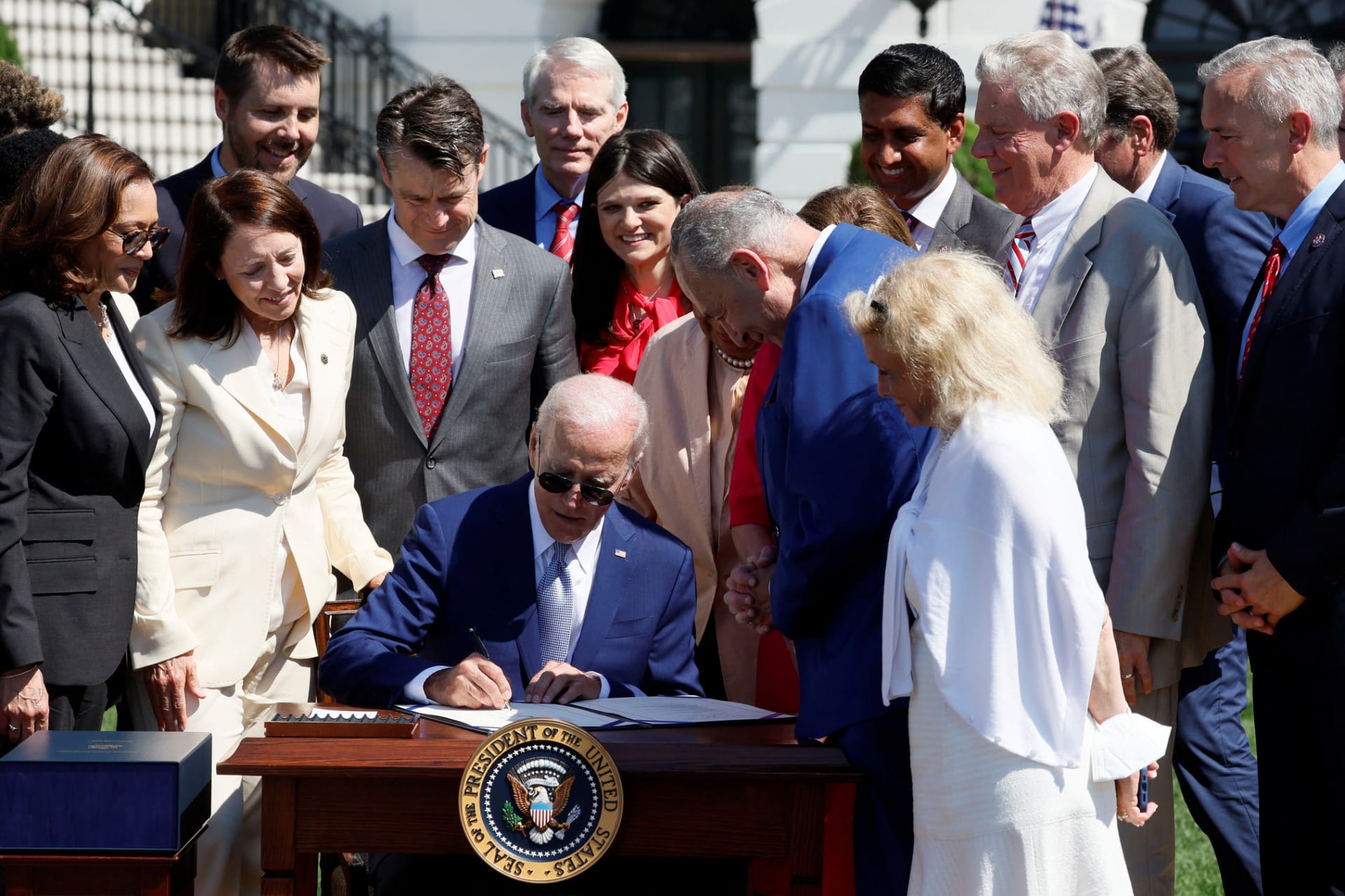 <p>U.S. President Joe Biden signs into law the CHIPS and Science Act on August 9, 2022 at the South Lawn of the White House</p>
