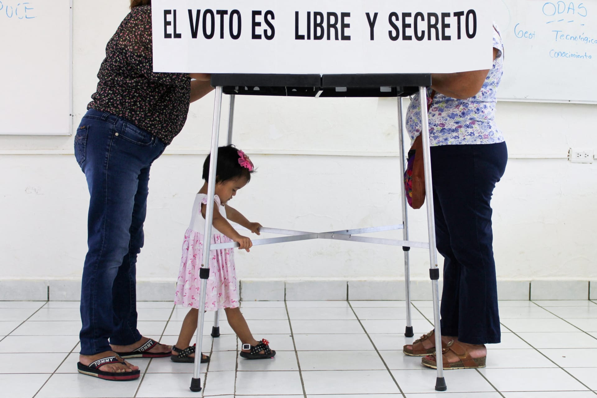 <p>Women cast their ballot at a polling station as Mexico holds a referendum on whether President Andres Manuel Lopez Obrador should continue in office, in Tuxla Chico, in Chiapas state, Mexico April 10, 2022. The text reads: “The vote is free and secret”.</p>
