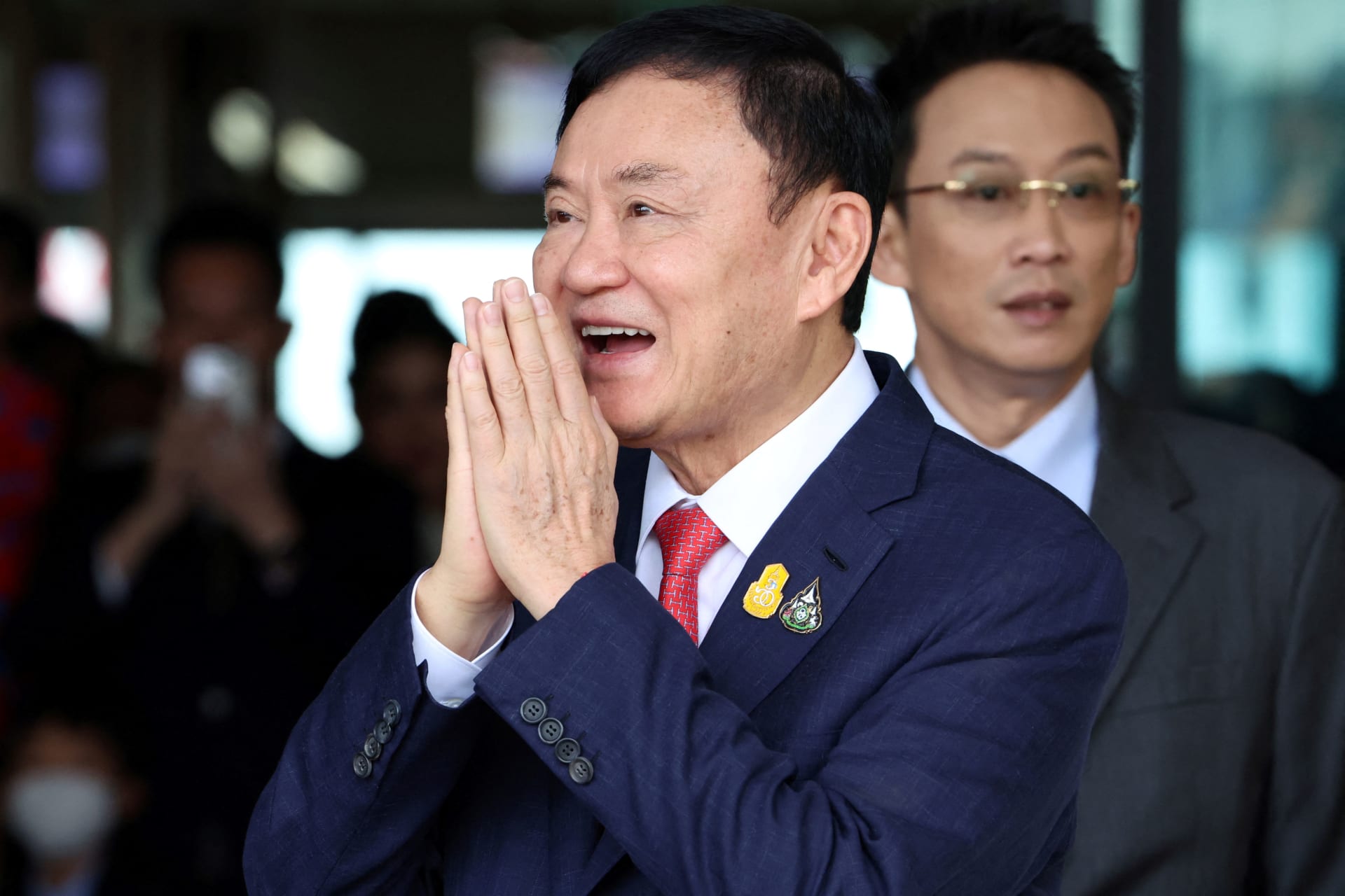 <p>Former Thai Prime Minister Thaksin Shinawatra gestures at Don Mueang airport in Bangkok, Thailand, on August 22, 2023. </p>
