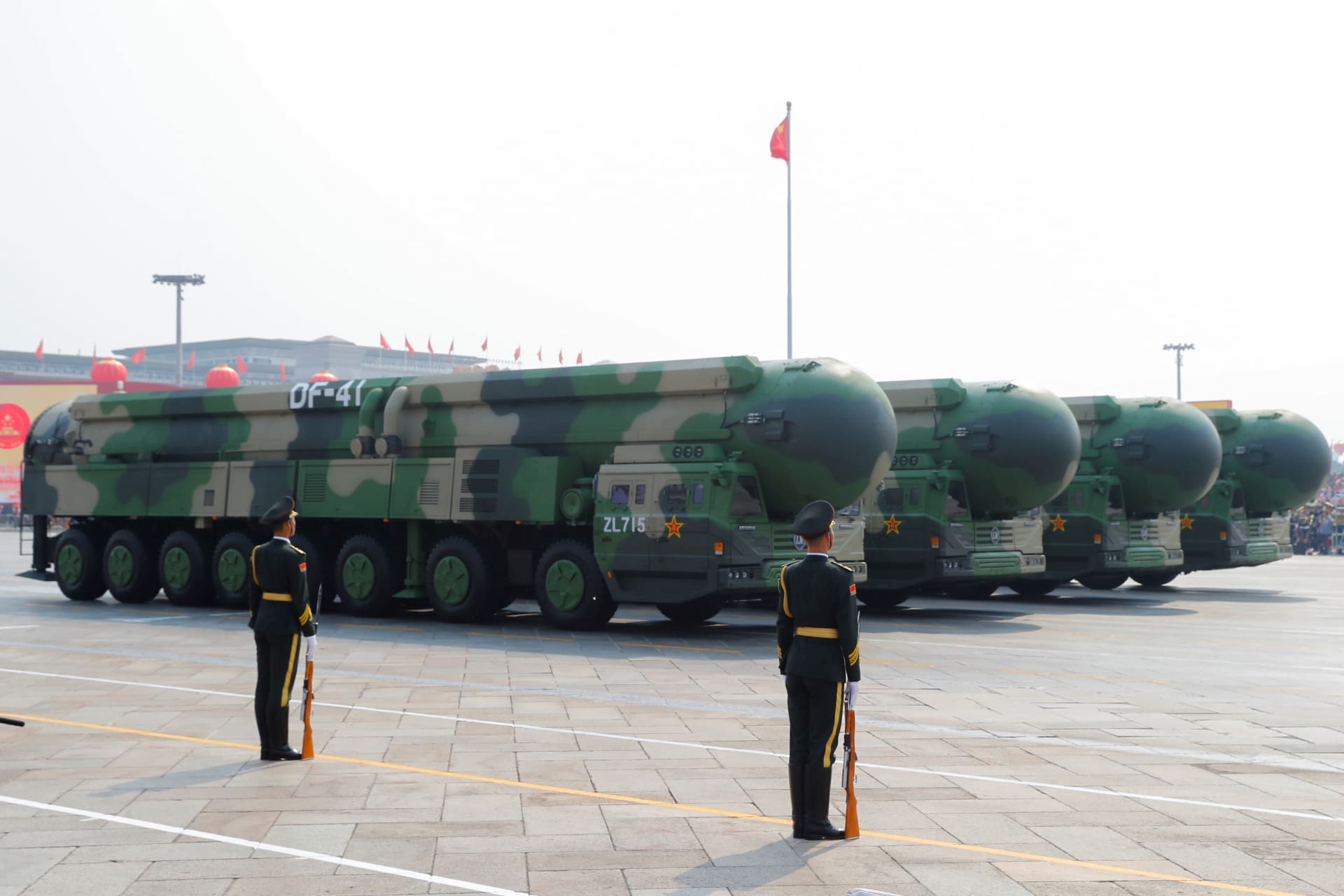 <p>Military vehicles carrying DF-41 intercontinental ballistic missiles drive past Tiananmen Square in Beijing, China, on October 1, 2019 to mark the 70th founding anniversary of People’s Republic of China.</p>
