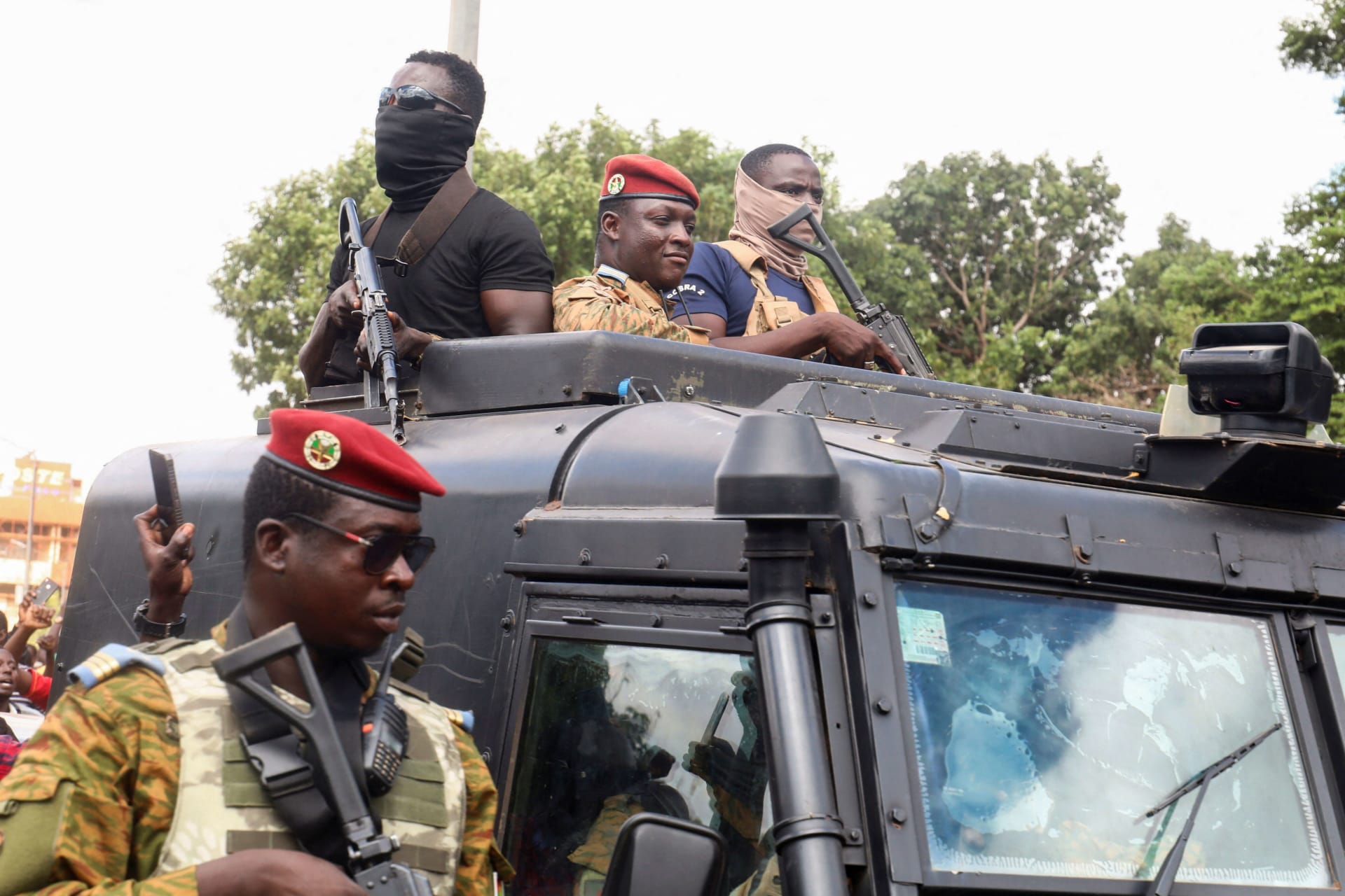 <p>Burkina Faso’s self-declared new leader Ibrahim Traore arrives at the national television standing in an armored vehicle in Ouagadougou, Burkina Faso on October 2, 2022.</p>
