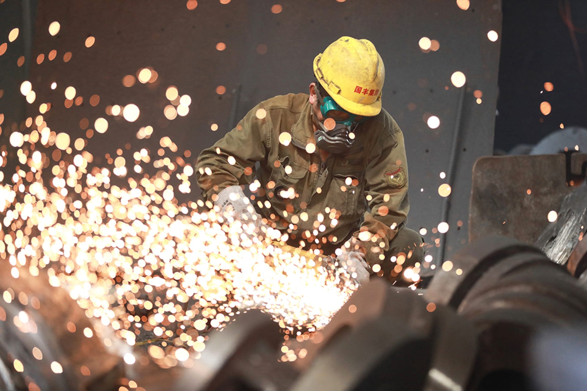 <p>A worker welding metal at a factory in Hangzhou, China, on July 15, 2023.</p>
