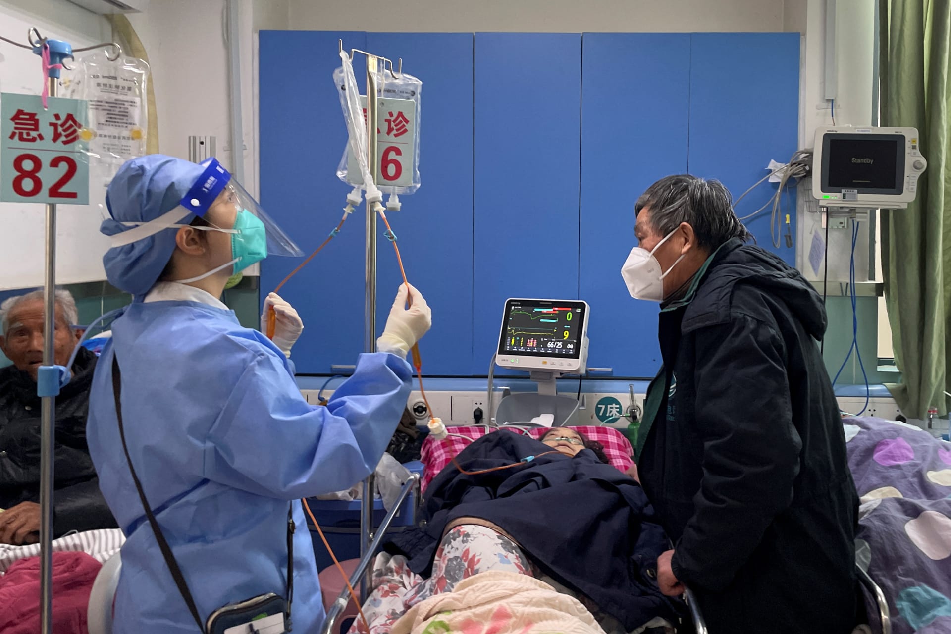 <p>A medical worker checks the IV drip treatment of a patient lying on a bed in the emergency department of a hospital, amid the coronavirus disease (COVID-19) outbreak in Shanghai, China, January 5, 2023. </p>
