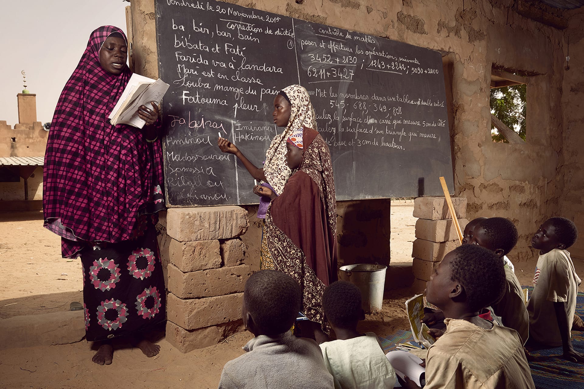 <p>Students use a converted prayer space as a classroom in Niger.</p>
