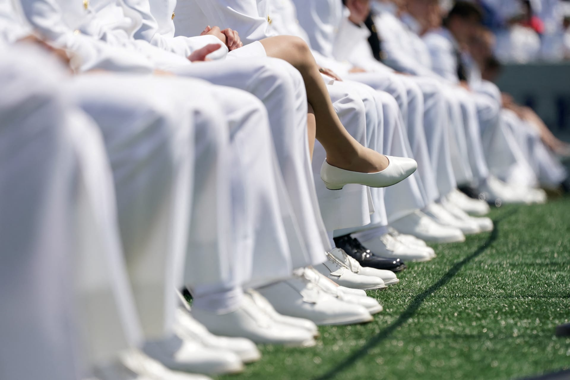 <p>Graduating midshipmen listen to proceedings during the U.S. Naval Academy graduation and commissioning ceremony in Annapolis, Maryland, U.S., May 26, 2023.</p>
