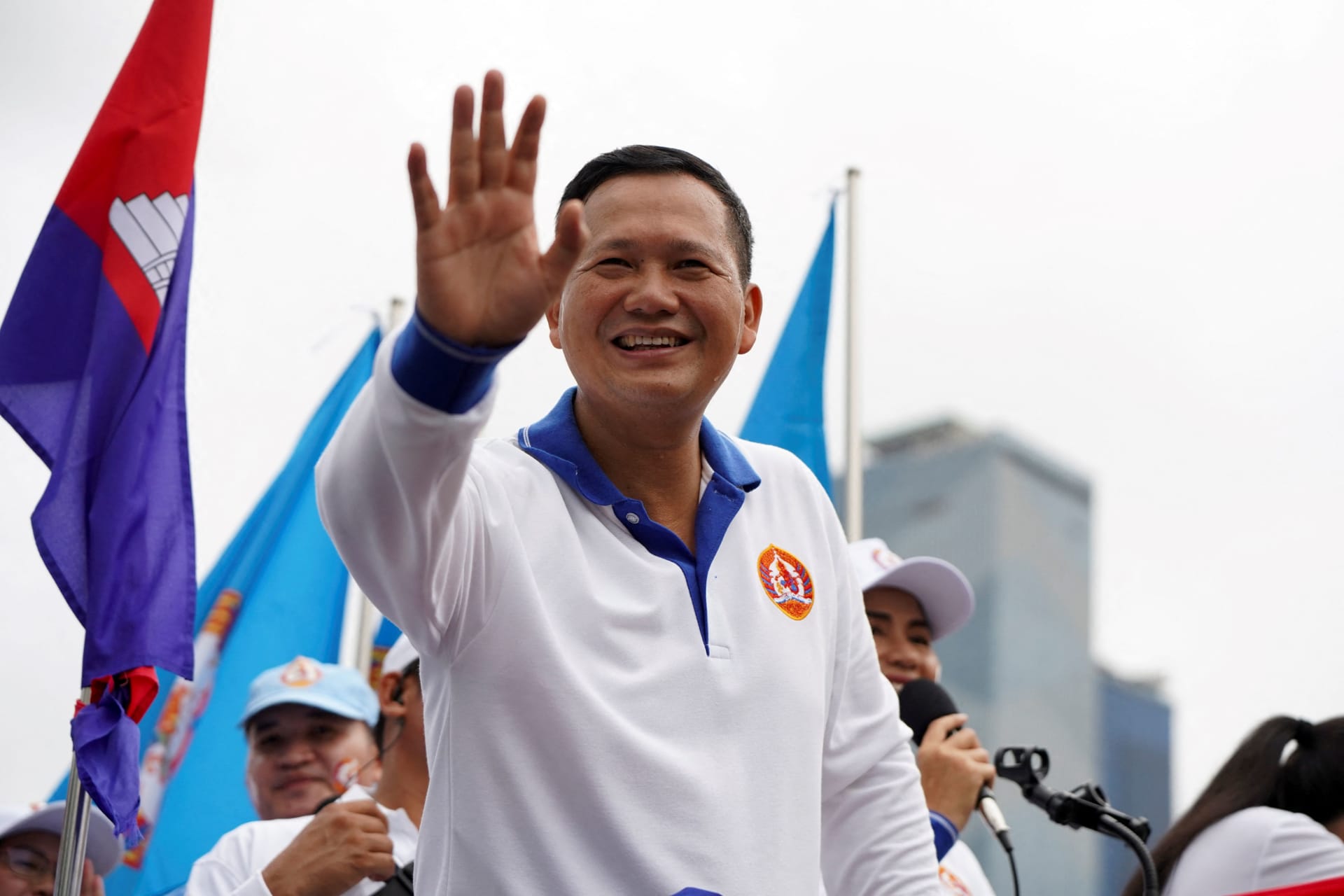 <p>Hun Manet, son of Cambodia’s Prime Minister Hun Sen, waves to people during the final Cambodian People’s Party (CPP) election campaign for the upcoming general election in Phnom Penh, Cambodia, on July 21, 2023.</p>
