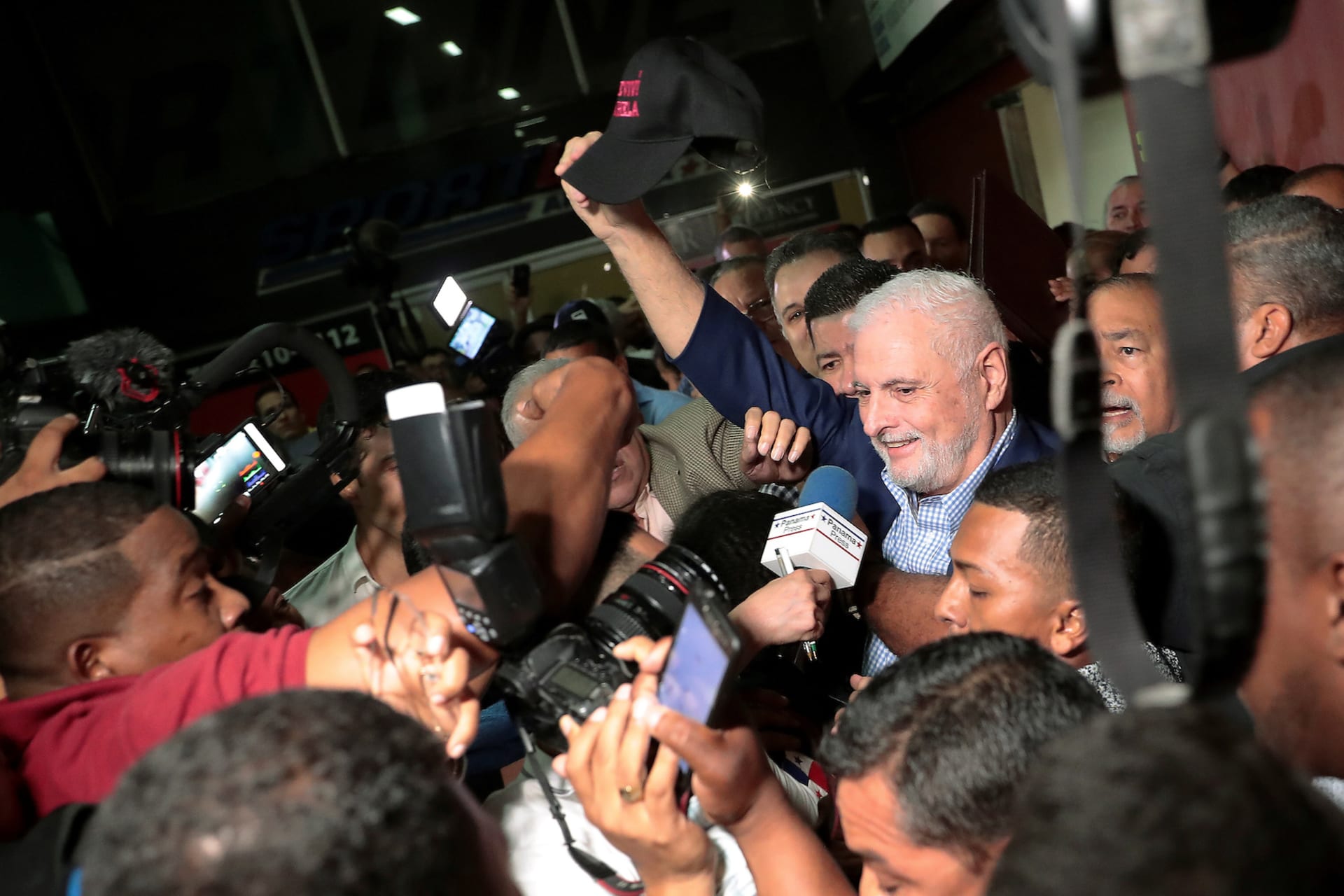 <p>Panama’s former President Ricardo Martinelli waves to supporters while leaving a courthouse in Panama City on August 10, 2019. Martinelli’s cap reads “I survived Varela,” referring to Panama’s former President Juan Carlos Varela.</p>
