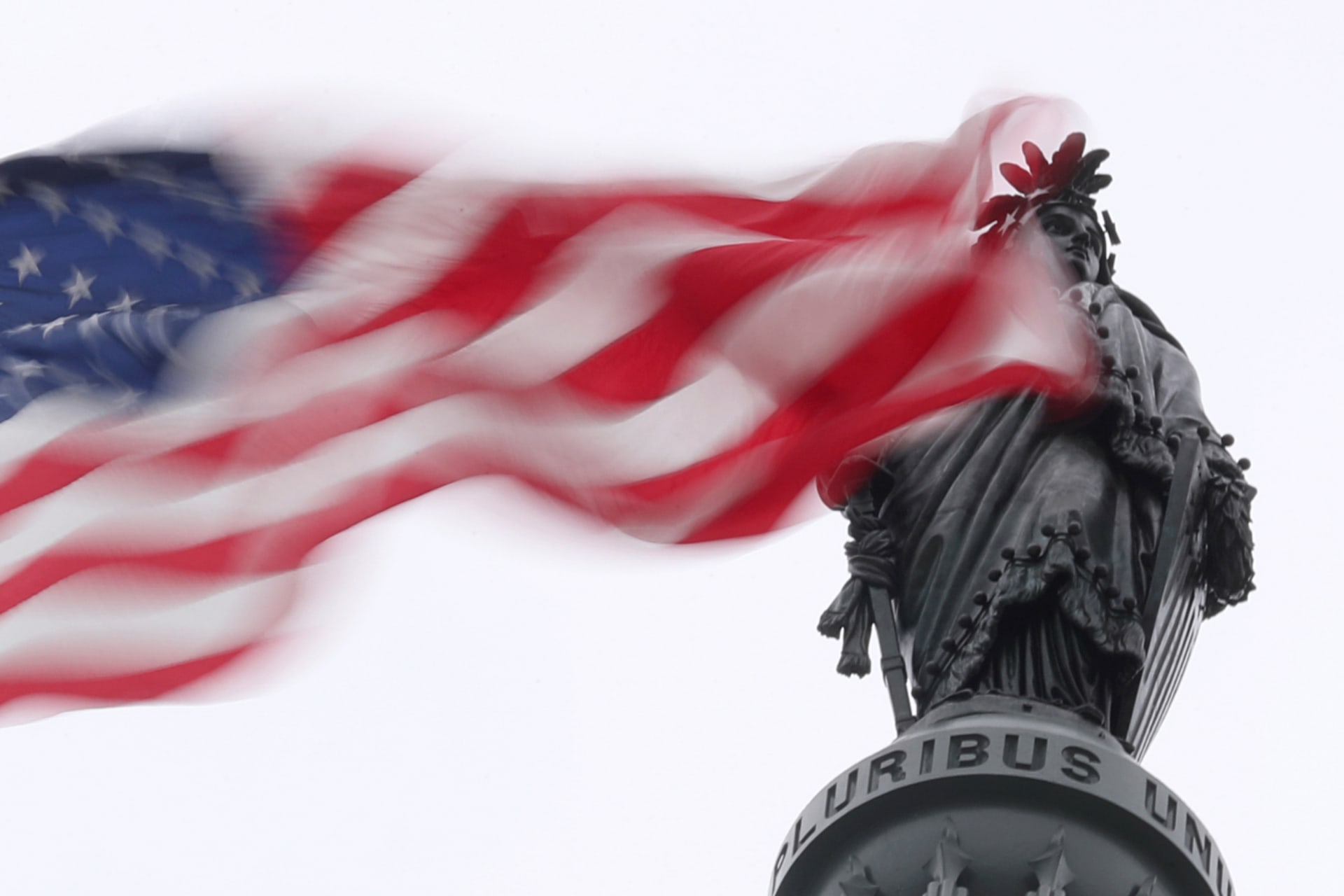 <p>The U.S. flag flies near the Statue of Freedom atop the U.S. Capitol in Washington, DC.</p>
