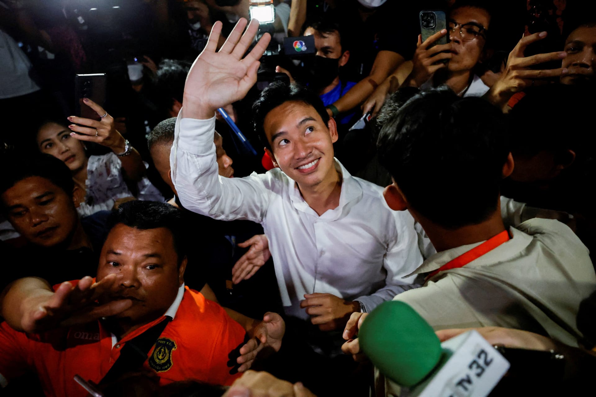 <p>Move Forward Party leader and prime ministerial candidate, Pita Limjaroenrat, waves to the crowd during the general election in Bangkok, Thailand.</p>
