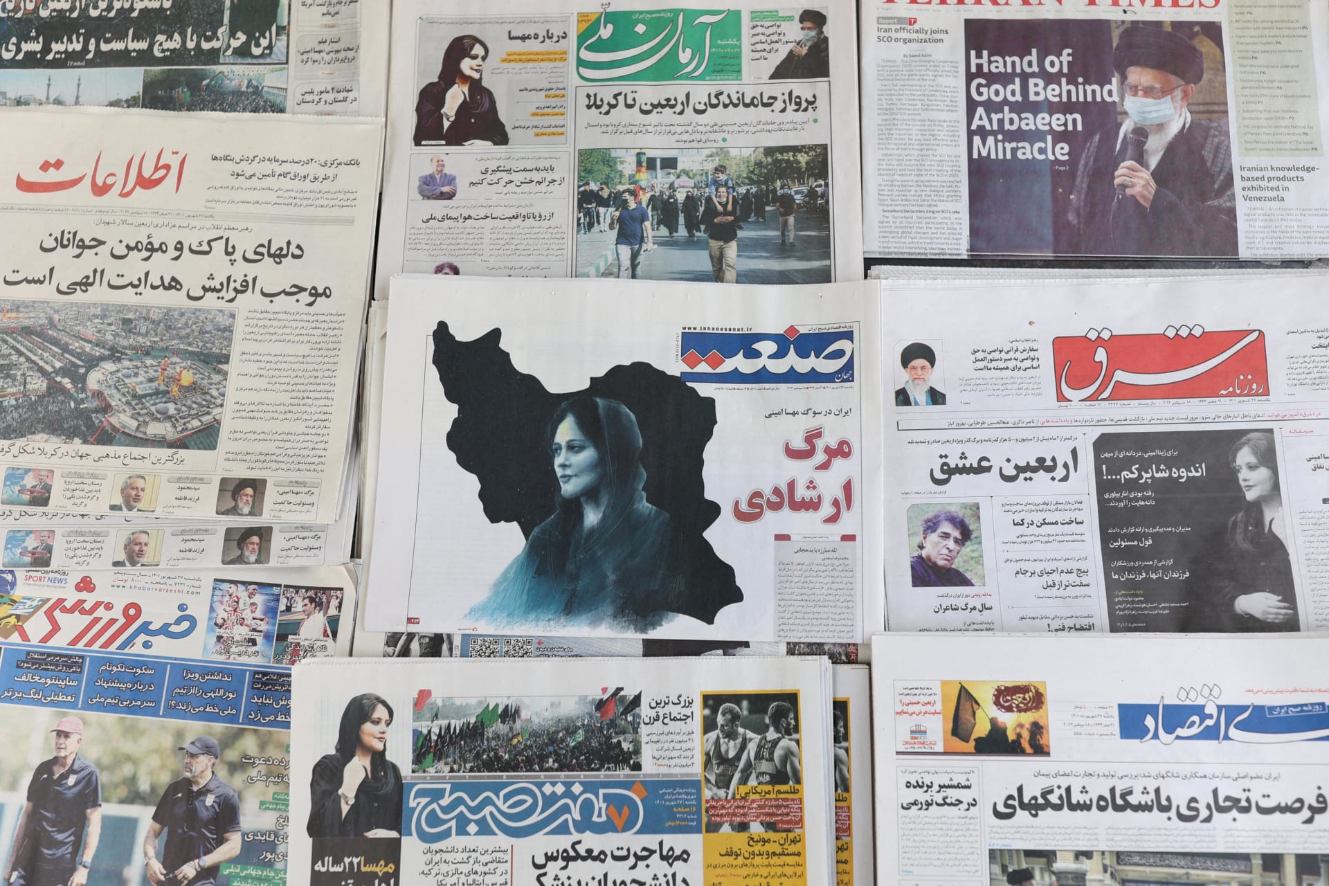 <p>Newspapers, with a cover picture of Mahsa Amini, a woman who died after being arrested by the Islamic republic’s “morality police” are seen in Tehran, Iran September 18, 2022.</p>
