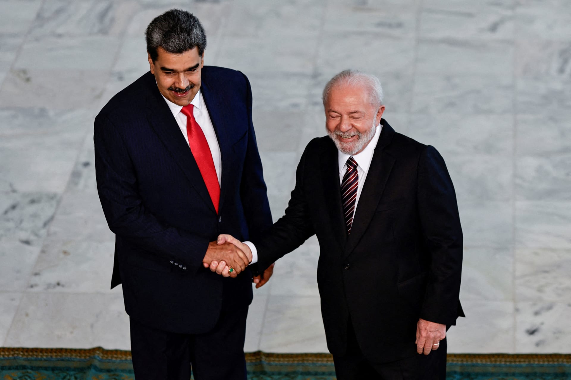 <p>Venezuela’s President Nicolás Maduro shakes hands with Brazil’s President Luiz Inácio Lula da Silva as they meet before a summit with presidents of South America, in Brasília, Brazil, May 29, 2023.</p>
