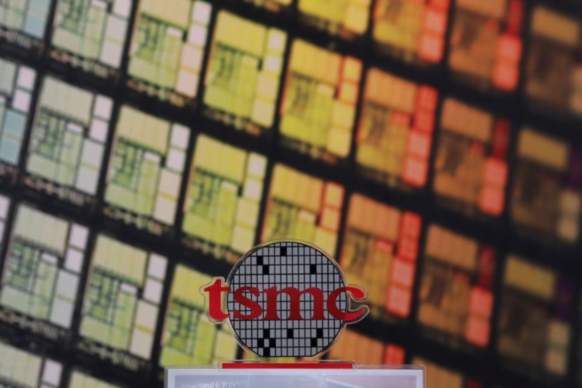 <p>The logo of Taiwan Semiconductor Manufacturing Company (TSMC) can be seen alongside images of silicon chips in Hsinchu, Taiwan.</p>
