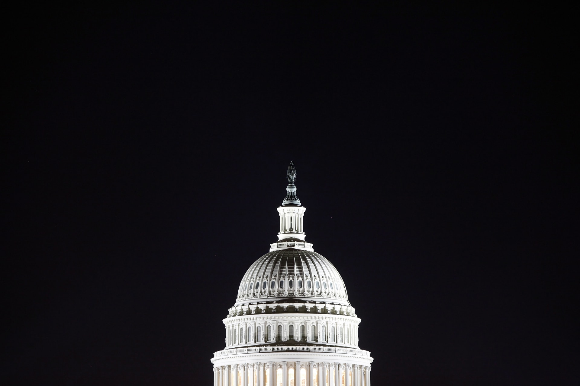 <p>The U.S. Capitol dome in the pre-dawn darkness in Washington, DC.</p>
