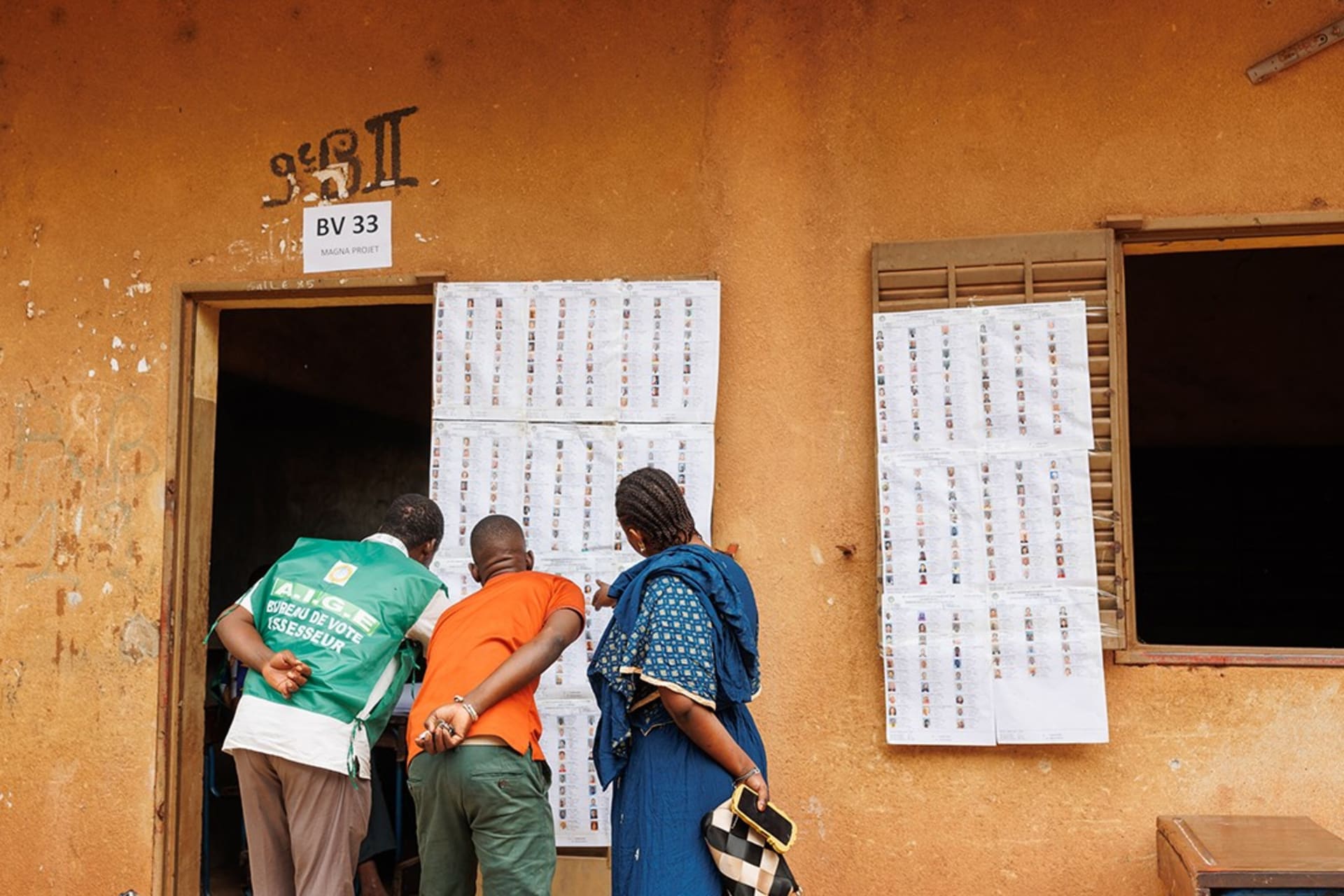 <p>Voters look for their names on the voters roll at a polling station ahead of Mali’s referendum vote in Bamako, Mali on June 18, 2023.</p>
