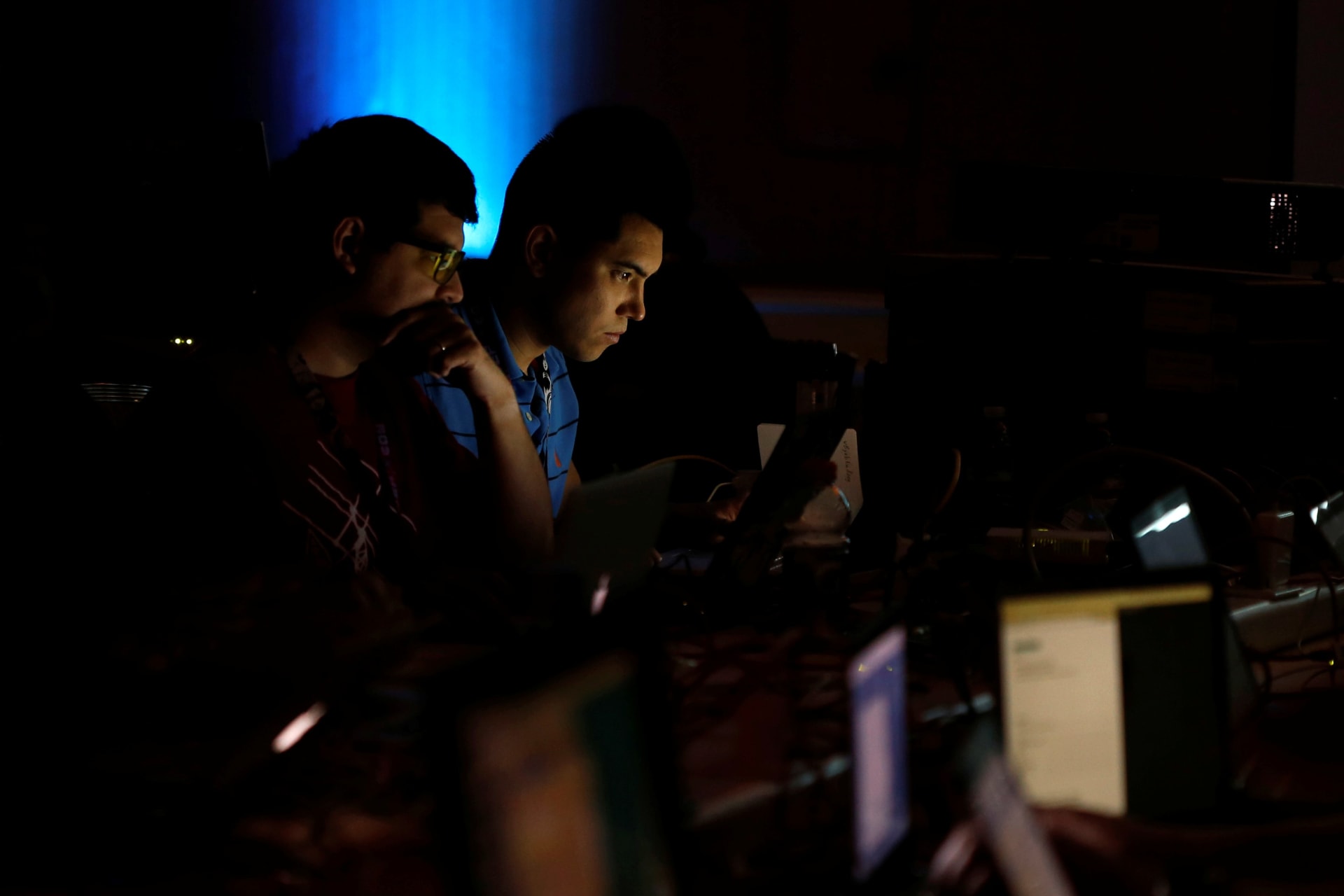 <p>Andrew Beard and Barrett Darnell compete in a contest during the Def Con hacker convention in Las Vegas, Nevada on July 29, 2017</p>
