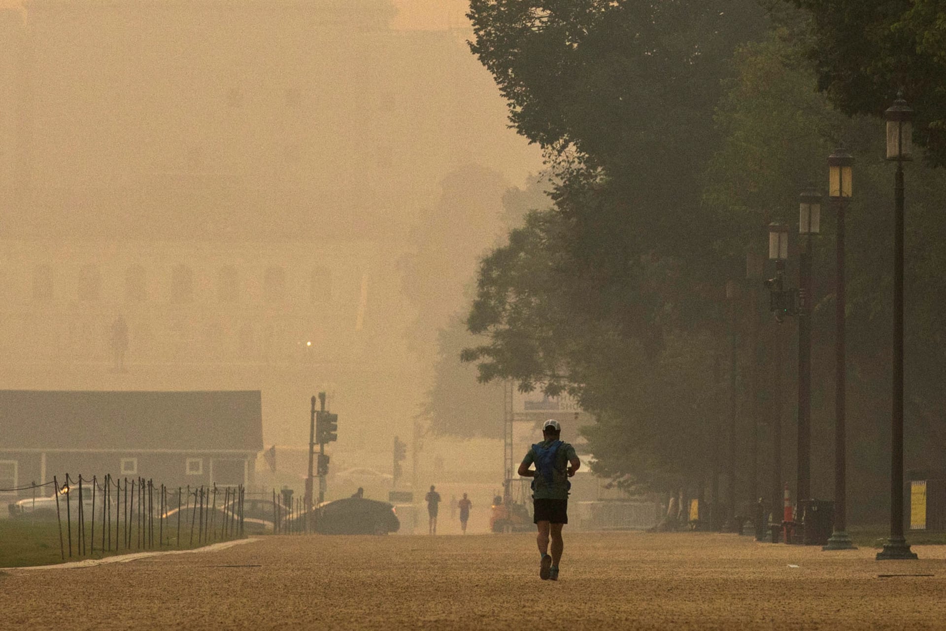 <p>Haze and smoke from the recent Canadian wildfires shroud the skies over the Capitol in Washington, D.C.</p>
