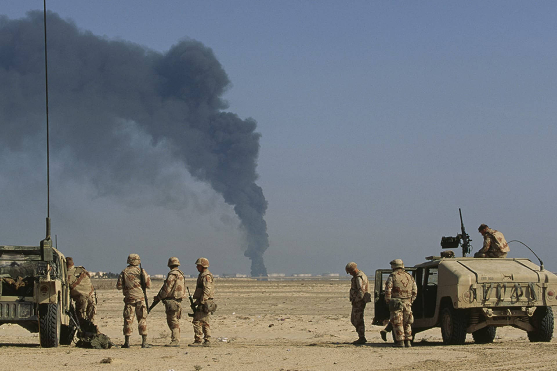 <p>U.S. soldiers arrive at a burning oil refinery in Al-Khafji, Saudi Arabia, during the Gulf War.</p>
