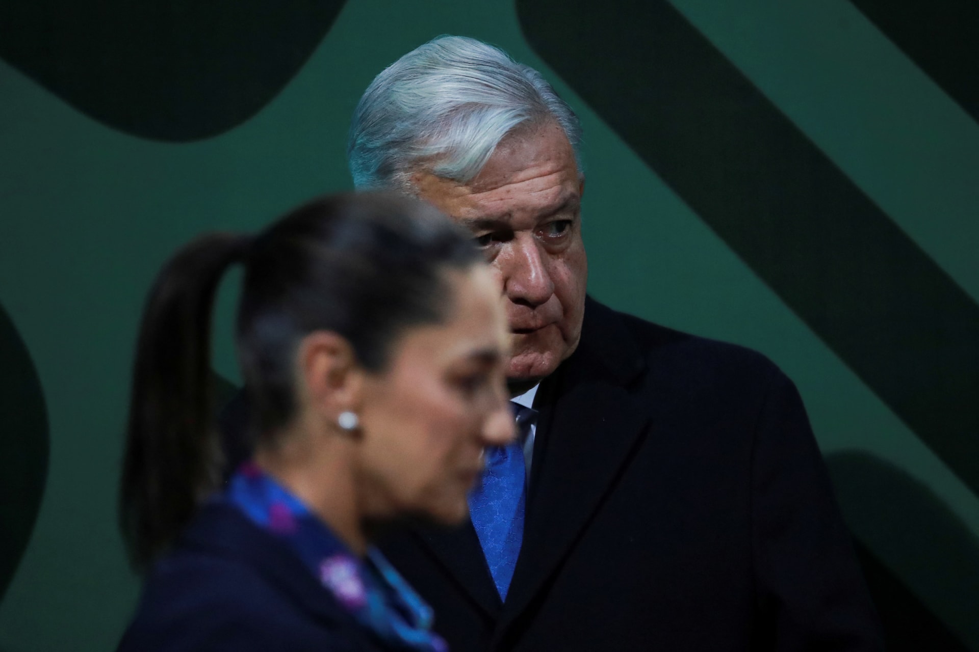 <p>Mexico City’s Governor Claudia Sheinbaum walks past Mexico’s President Andrés Manuel López Obrador during a news conference in Mexico City, Mexico, January 20, 2023.</p>
