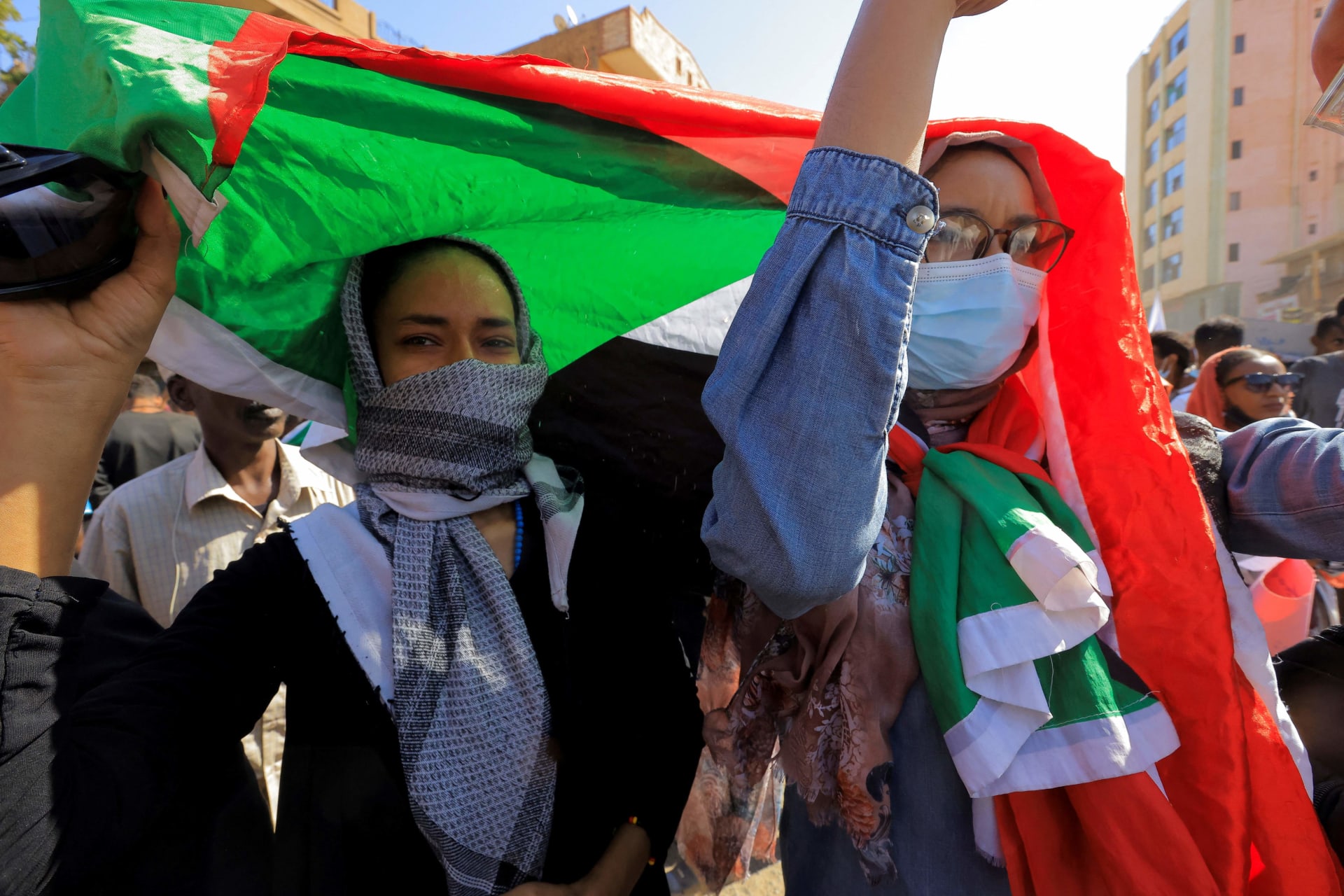 <p>Protesters march during a rally commemorating the fourth anniversary of the uprising that toppled former leader Omar al-Bashir in Khartoum, Sudan December 19, 2022.</p>
