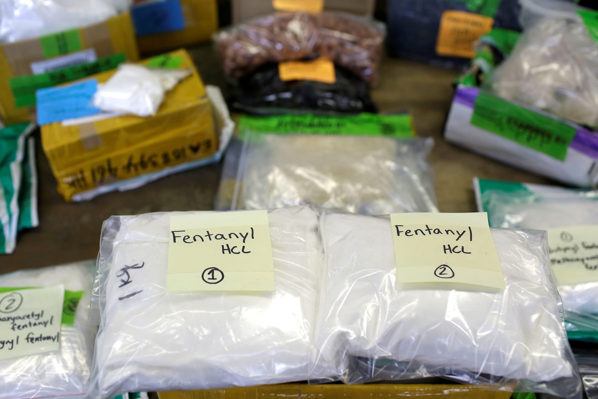 <p>Plastic bags of fentanyl are displayed on a table at the U.S. Customs and Border Protection area at the International Mail Facility at O’Hare International Airport in Chicago on November 29, 2017.</p>
