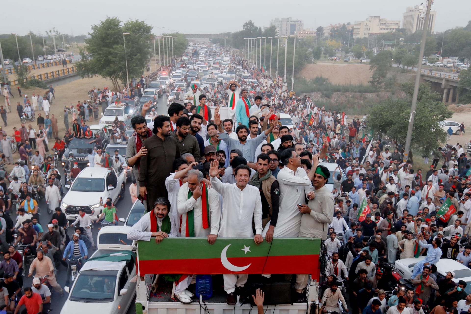 <p>Former Pakistani Prime Minister Imran Khan waves to supporters at the start of a protest march in Islamabad, Pakistan, May 26, 2022. </p>
