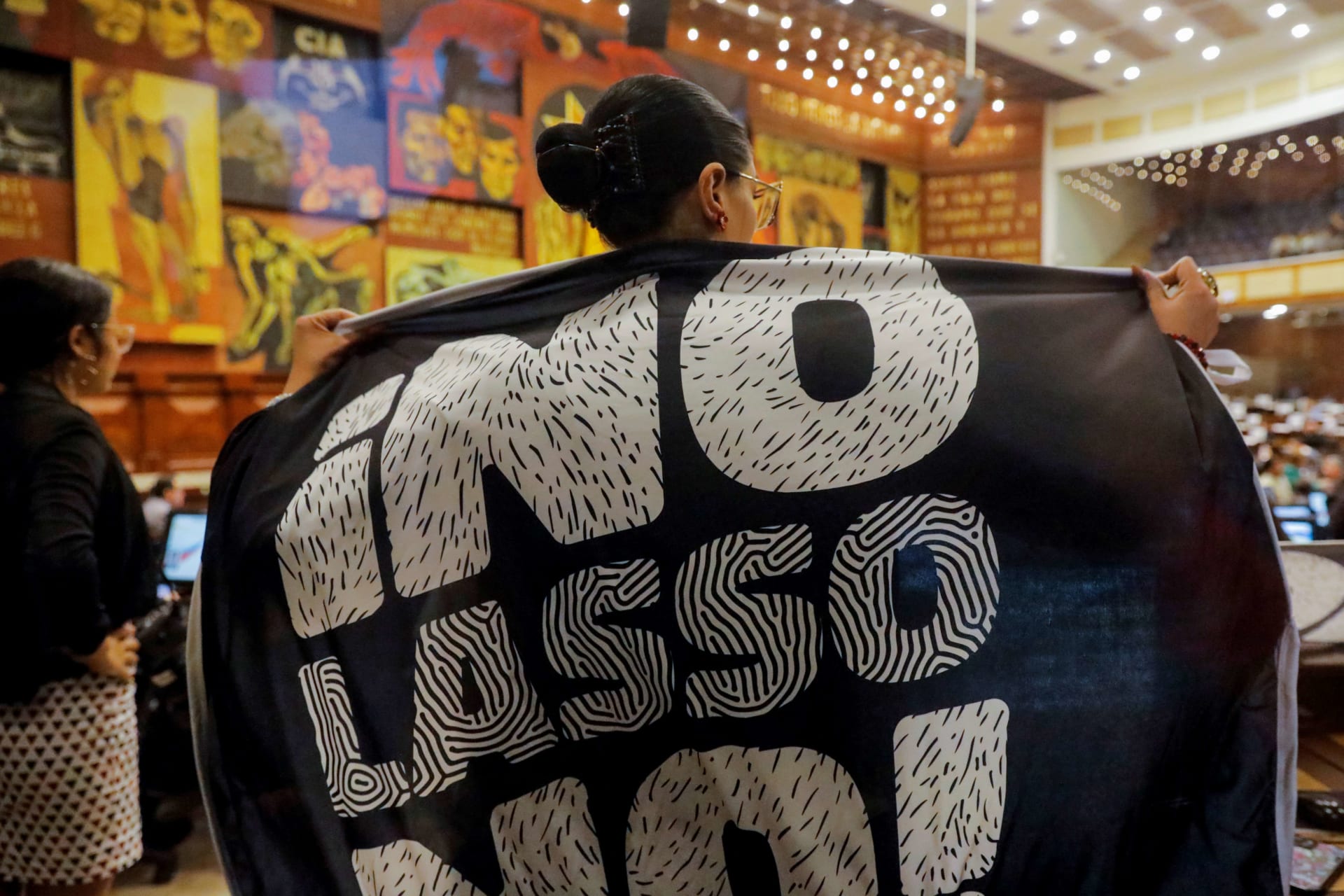<p>An opposition assembly member wrapped in a banner that reads “No, Lasso no!” stands during a vote on whether to proceed with an impeachment process against Ecuador’s President Guillermo Lasso, at the National Assembly in Quito, Ecuador May 9, 2023.</p>
