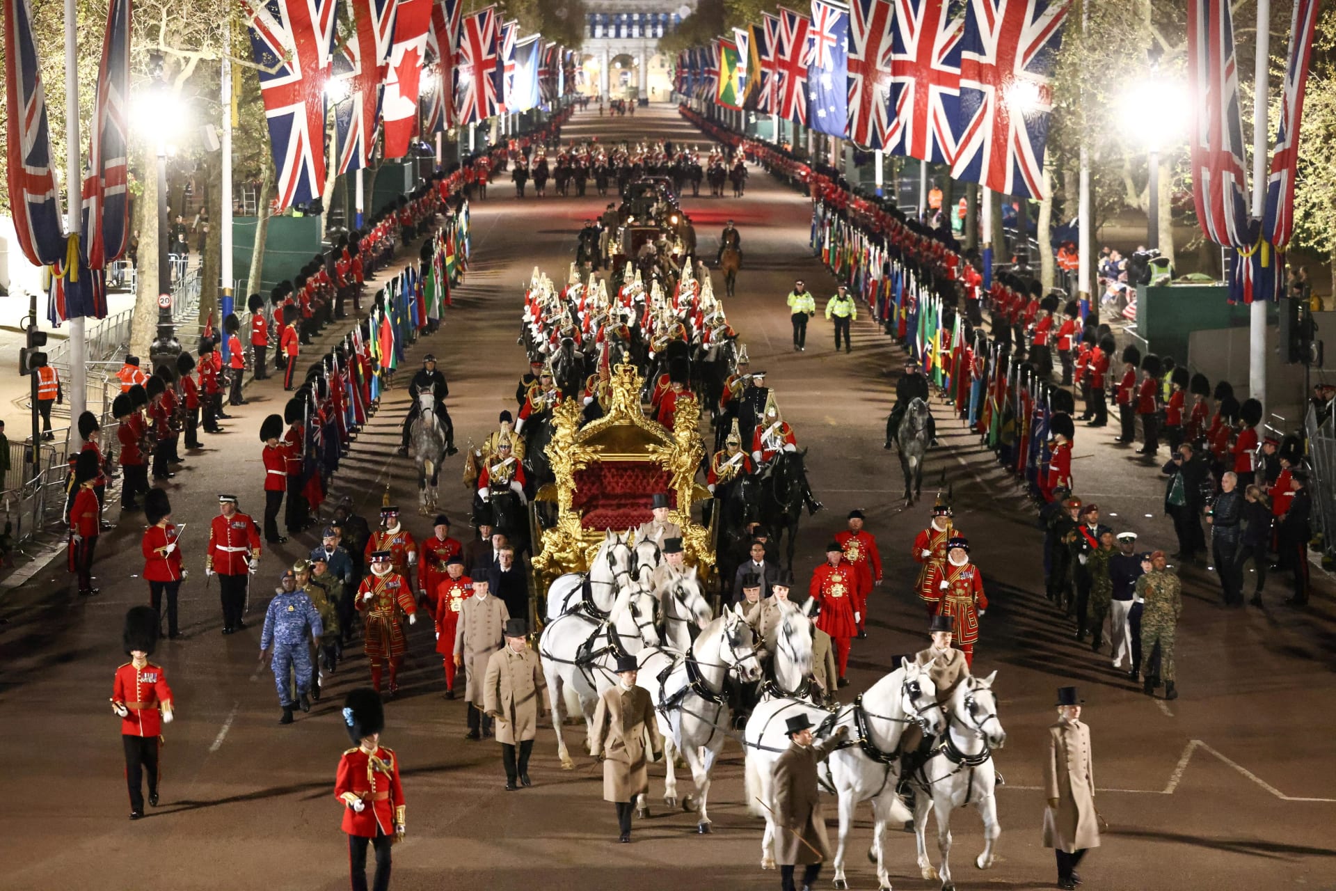 <p>The Gold State Coach is ridden alongside members of the military during a full overnight dress rehearsal of the coronation ceremony of Britain’s King Charles III.</p>
