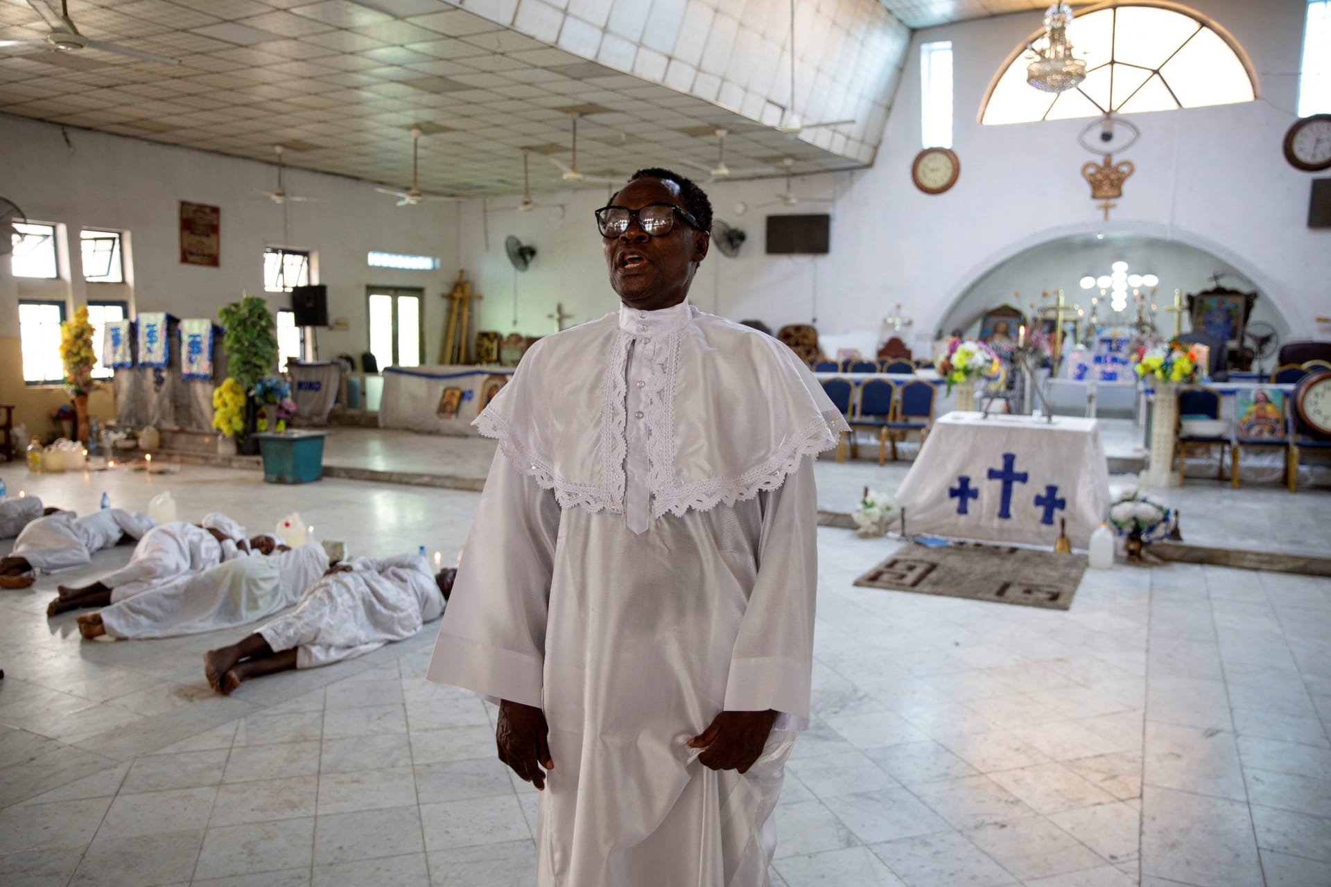 <p>Afis Kiki, Shepherd-in-Charge of the Celestial Church of Christ National Headquarters, addresses congregants on the eve of the election in Makoko, Lagos, Nigeria on February 24, 2023.</p>
