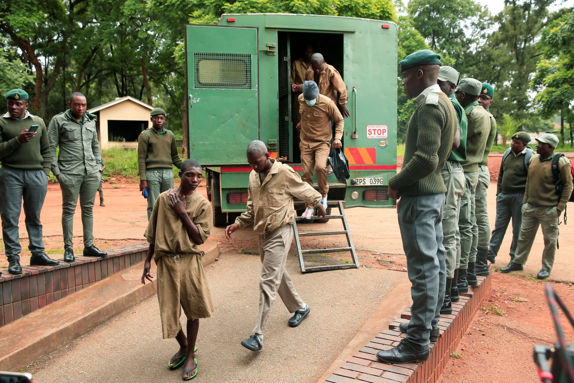 <p>Members of the opposition party Citizens Coalition for Change arrive at the Magistrates court after being arrested on charges of unlawful gatherings and inciting violence in Harare, Zimbabwe on January 17, 2023.</p>
