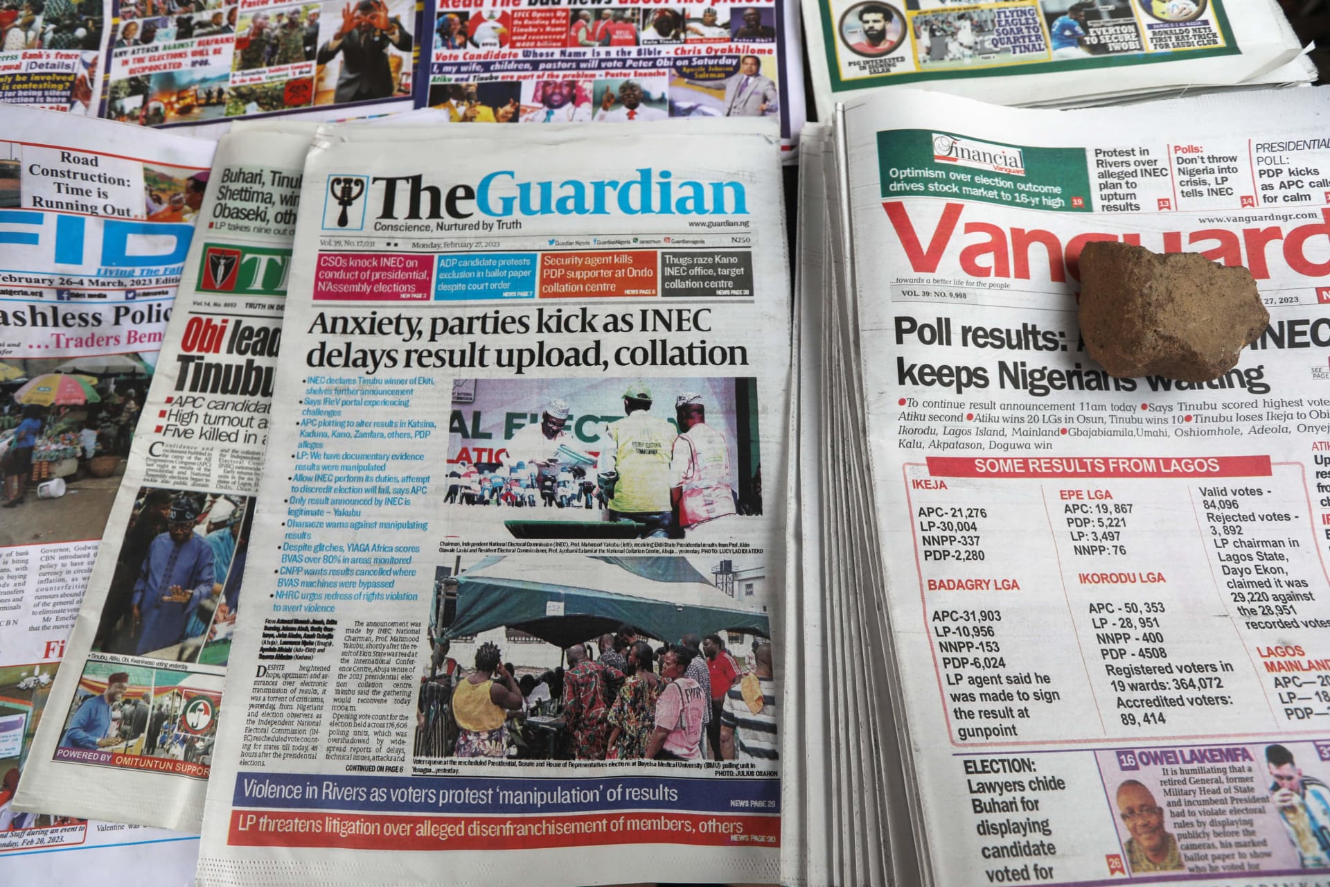 <p>Newspapers are displayed at a street vendor, before the announcement of election results by Independent National Electoral Commission, in Awka, Anambra state, Nigeria on February 27, 2023.</p>
