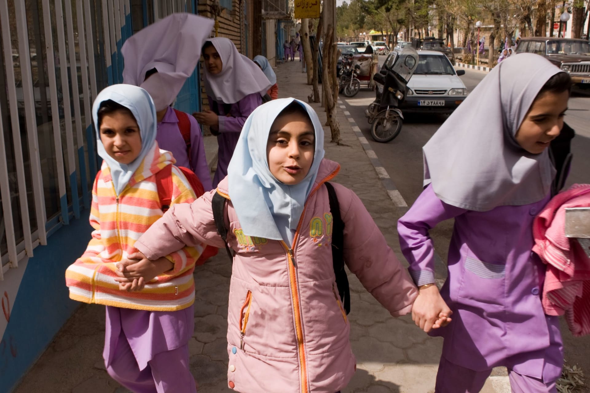 <p>School girls walk down the street in Iranian President Mahmoud Ahmadinejad’s birth village of Aradan.</p>

