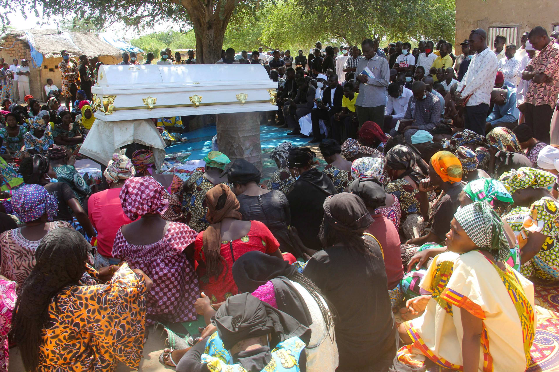 <p>Relatives and friends gather around the coffin of Oredje Narcisse, the Chadian journalist who was killed during a pro-democracy demonstration, as they attend his burial ceremony in N’Djamena, Chad, on October 28, 2022.</p>
