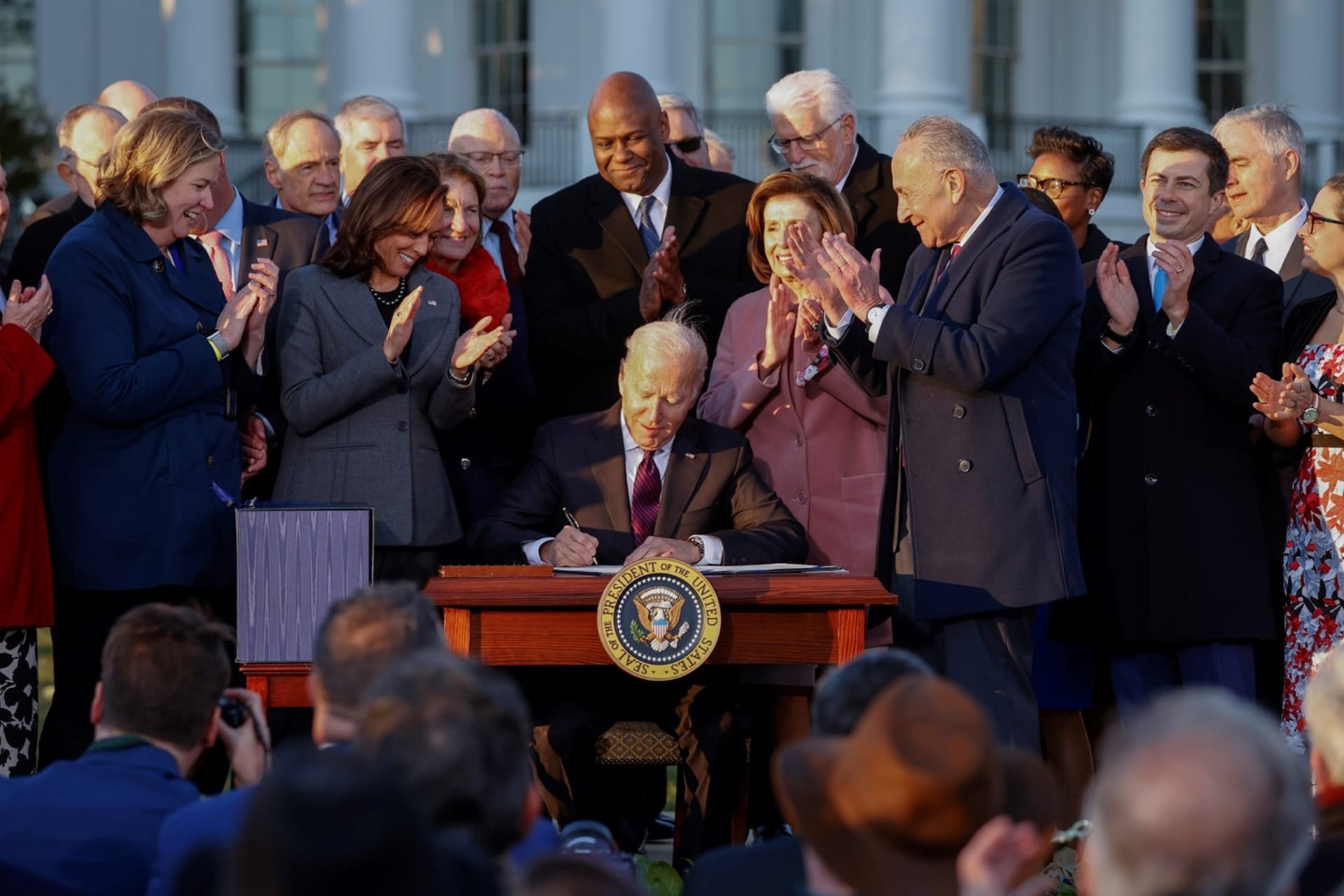 <p>U.S. President Joe Biden signs the Infrastructure Investment and Jobs Act on the South Lawn at the White House in Washington, D.C. November 15, 2021.</p>
