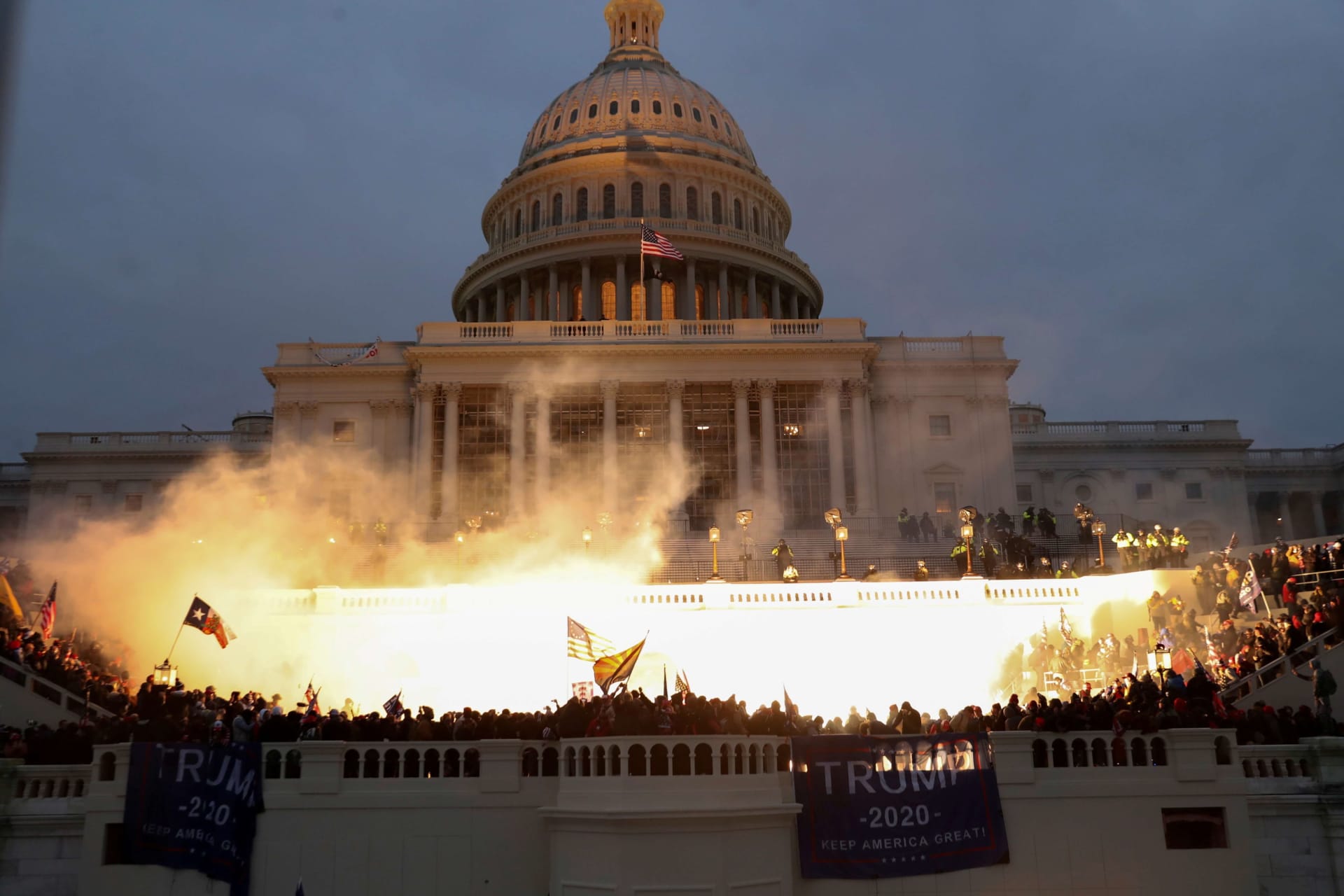 <p>An explosion caused by a police munition is seen while supporters of U.S. President Donald Trump riot in front of the U.S. Capitol Building in Washington, U.S., January 6, 2021. </p>
