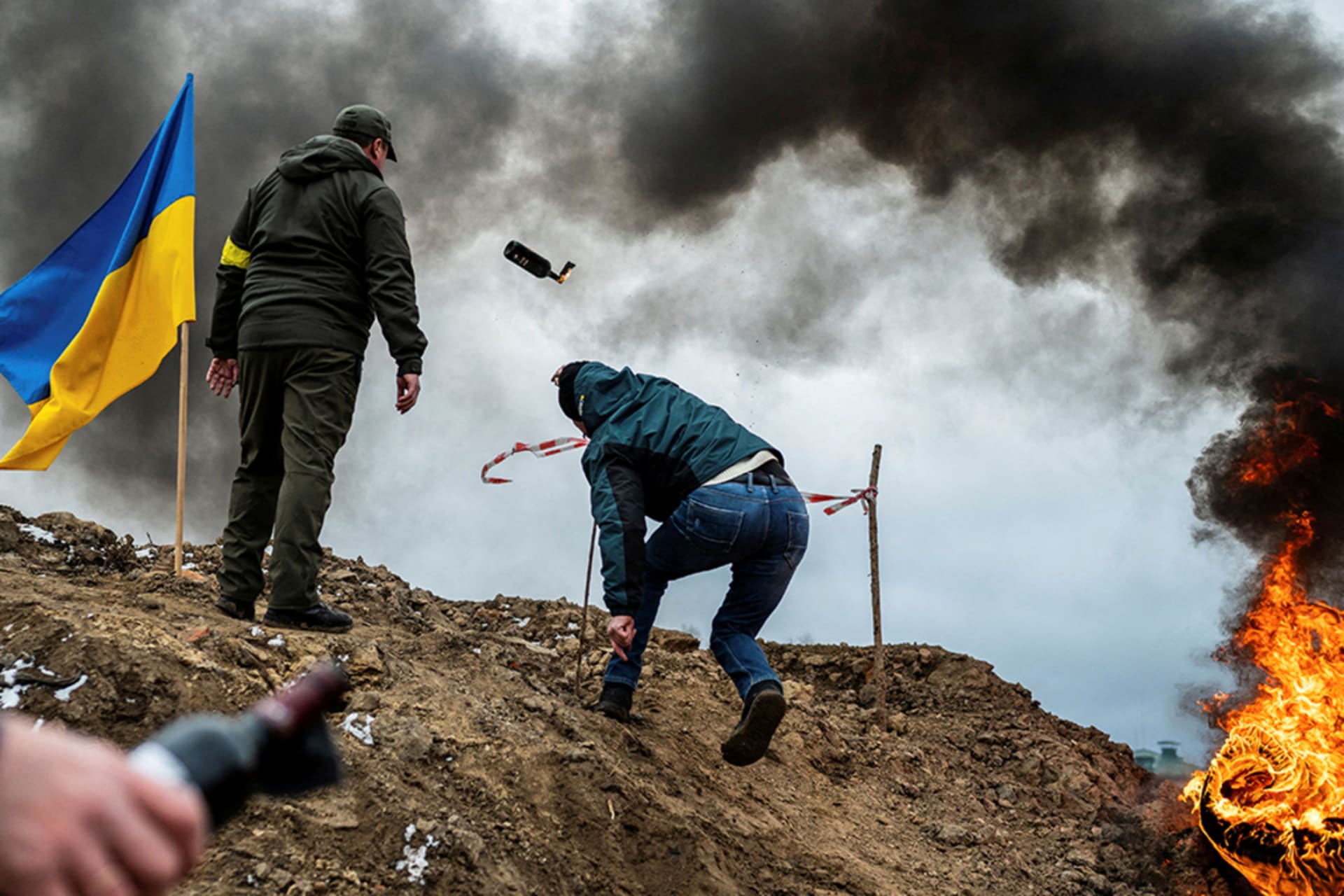 <p>A civilian in Zhytomyr, Ukraine trains to throw Molotov cocktails to defend the city after Russia’s invasion of Ukraine in March, 2022. </p>
