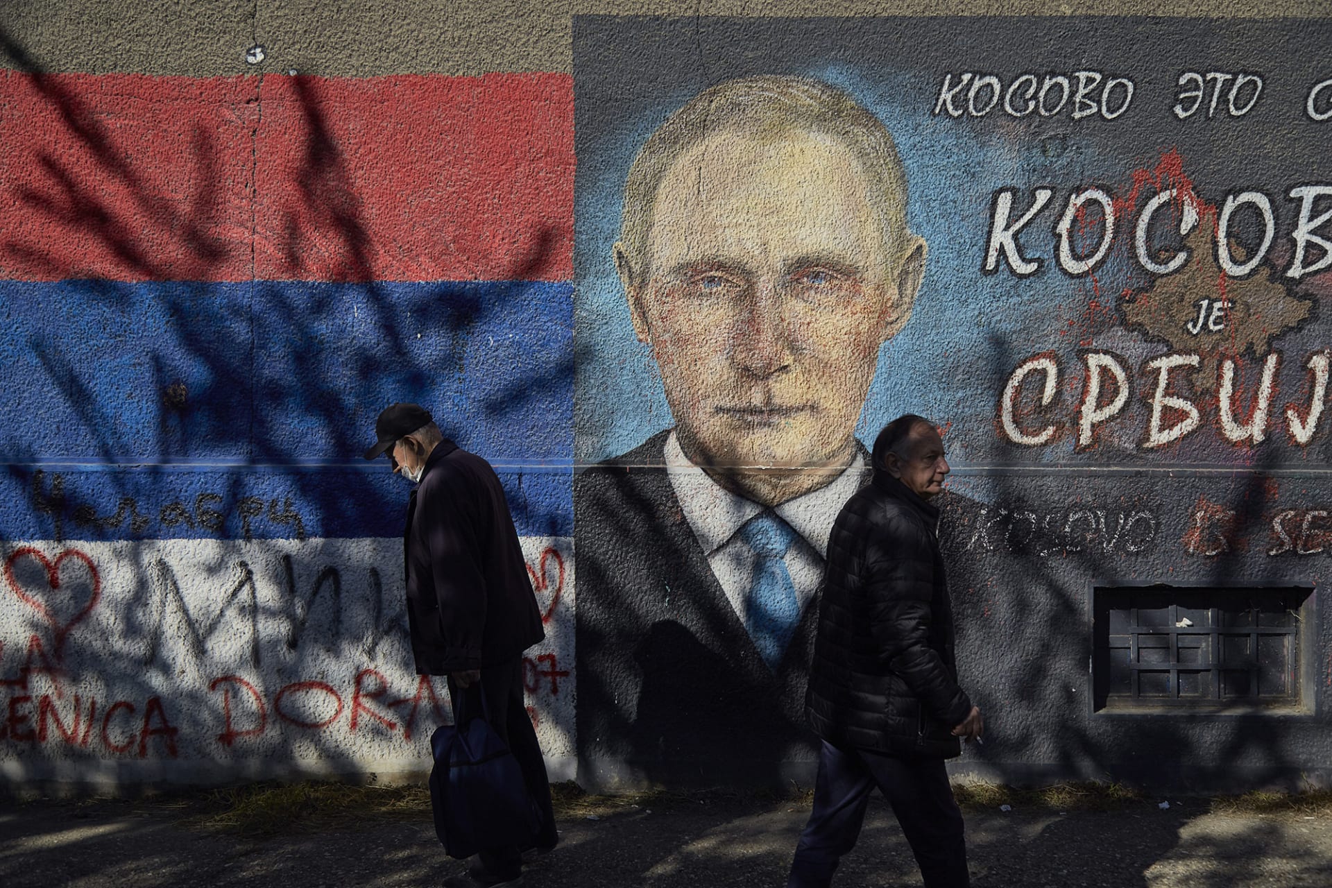 <p>A mural in Belgrade depicts Russian President Vladimir Putin and a text reading “Kosovo is Serbia.”</p>
