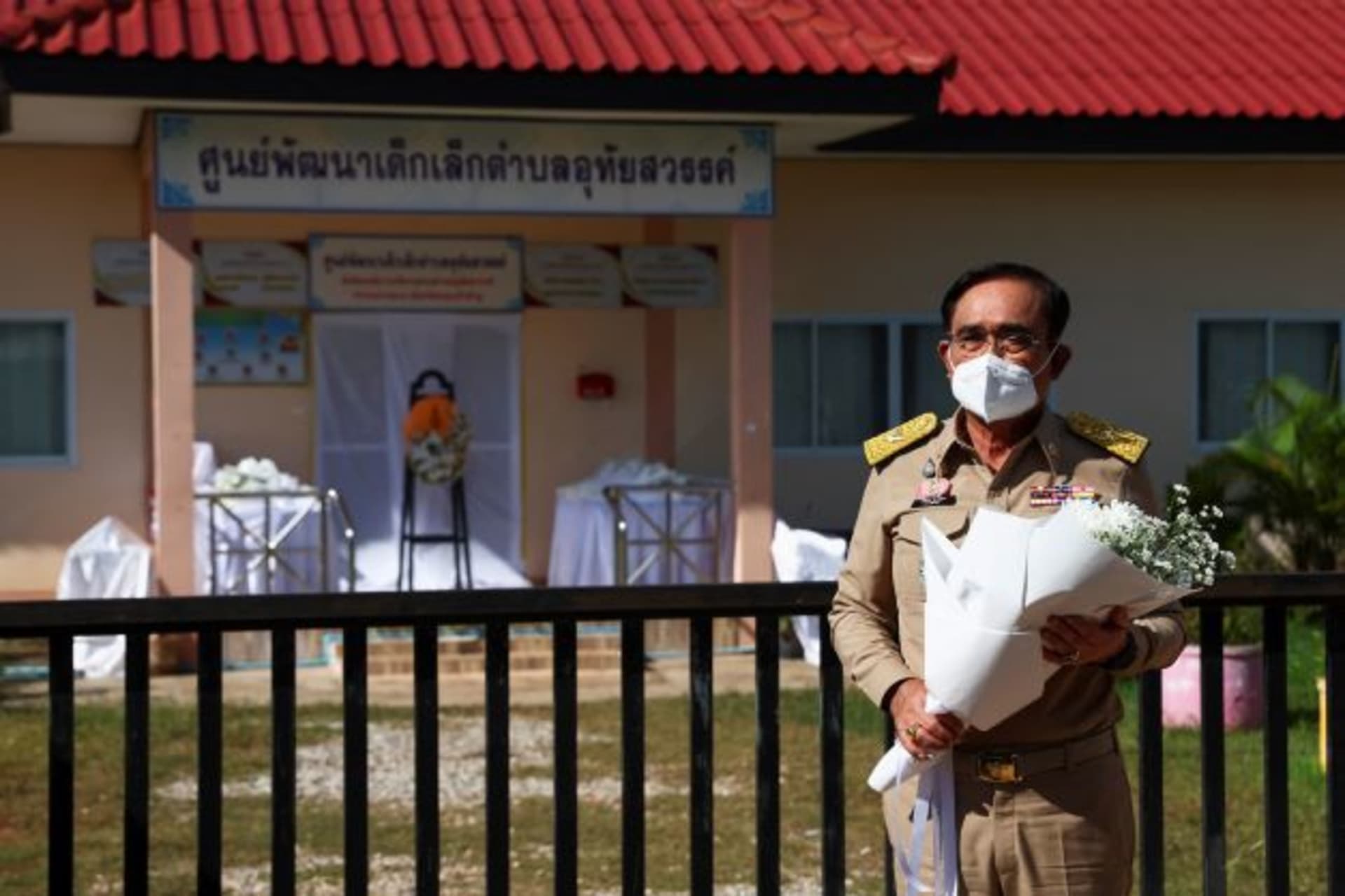 <p>Thailand’s Prime Minister Prayut Chan-o-cha pays his respects outside the day care centre which was the scene of a mass shooting, in the town of Uthai Sawan, Nong Bua Lam Phu province, Thailand, October 7, 2022.</p>