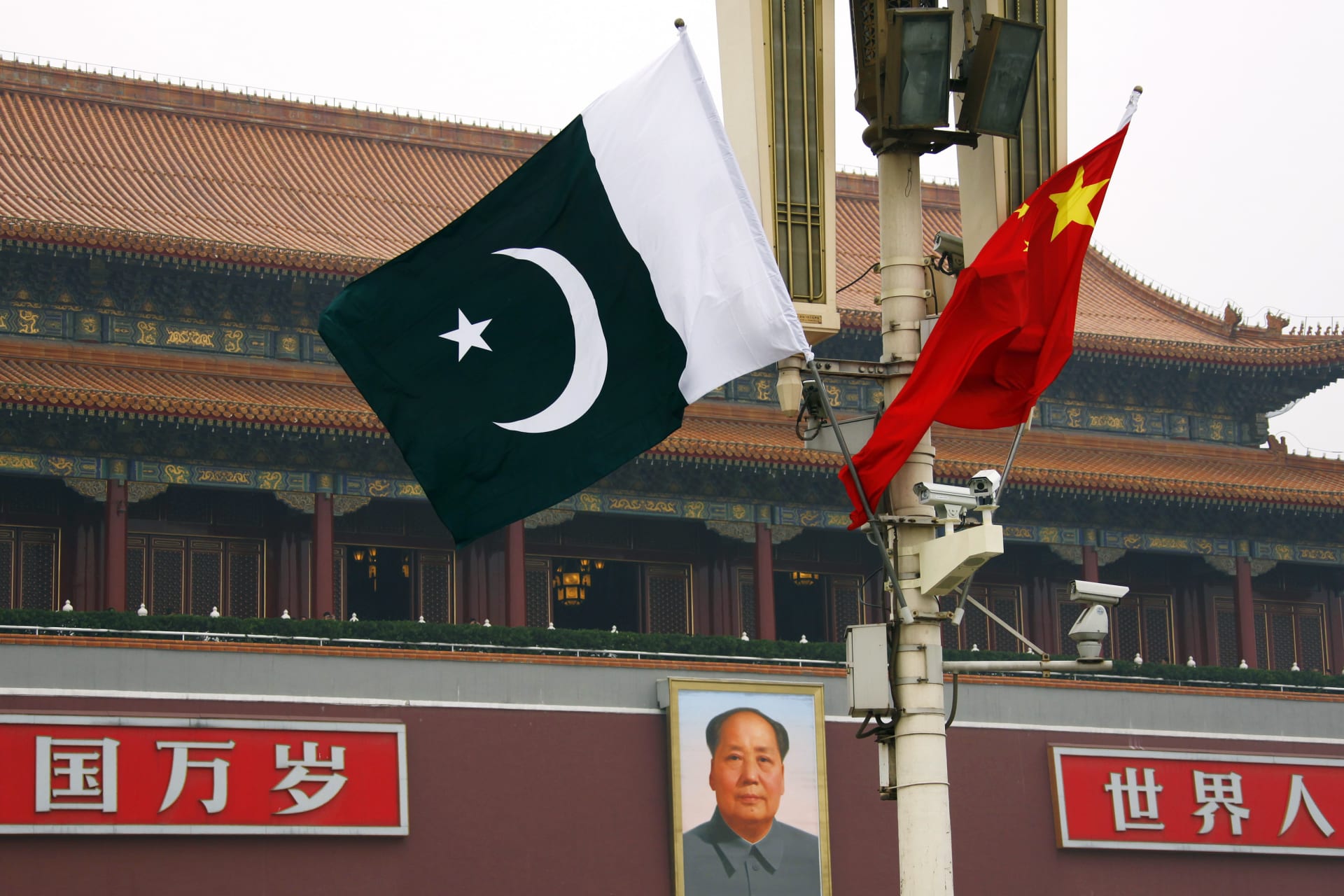 <p>A Pakistani national flag flies alongside a Chinese national flag in front of the portrait of Chairman Mao Zedong on Beijing’s Tiananmen Square.</p>
