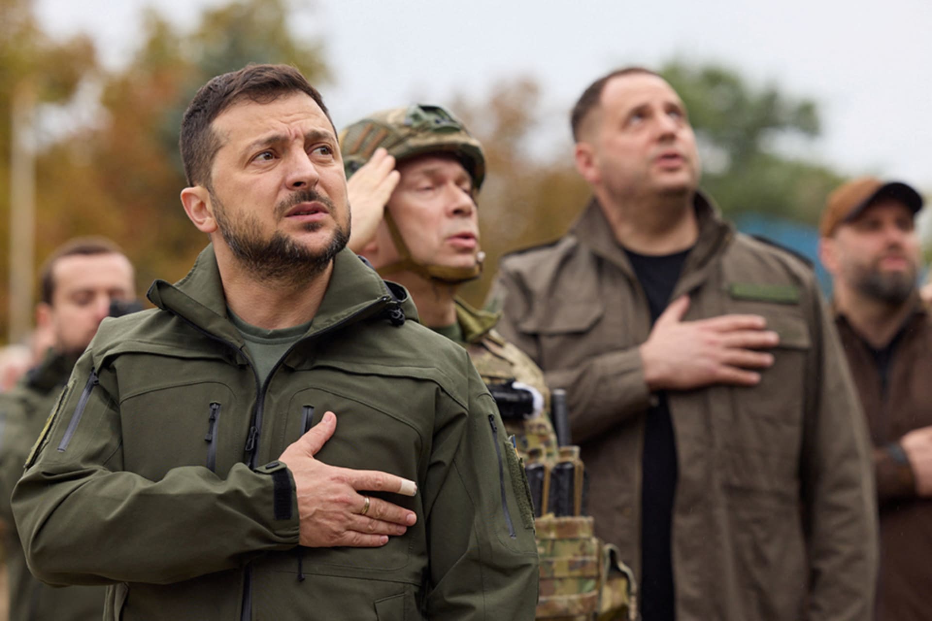 <p>Ukraine’s President Zelensky sings a national anthem on September 14, 2022 during a flag rising ceremony in the recently liberated town of Izium in the Kharkiv region.</p>
