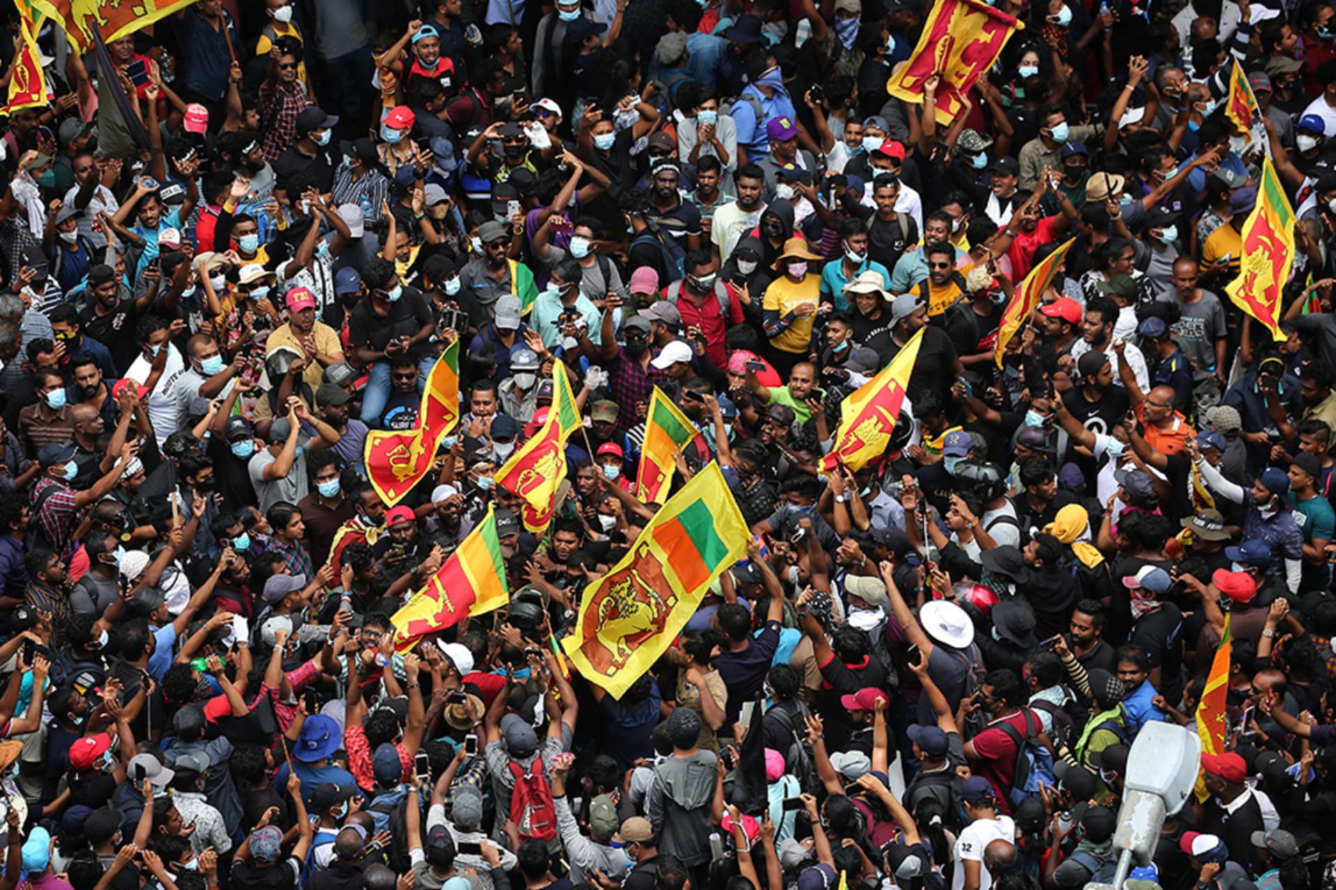<p>Protesters gather in a street leading to the Sri Lankan President’s official residence</p>
