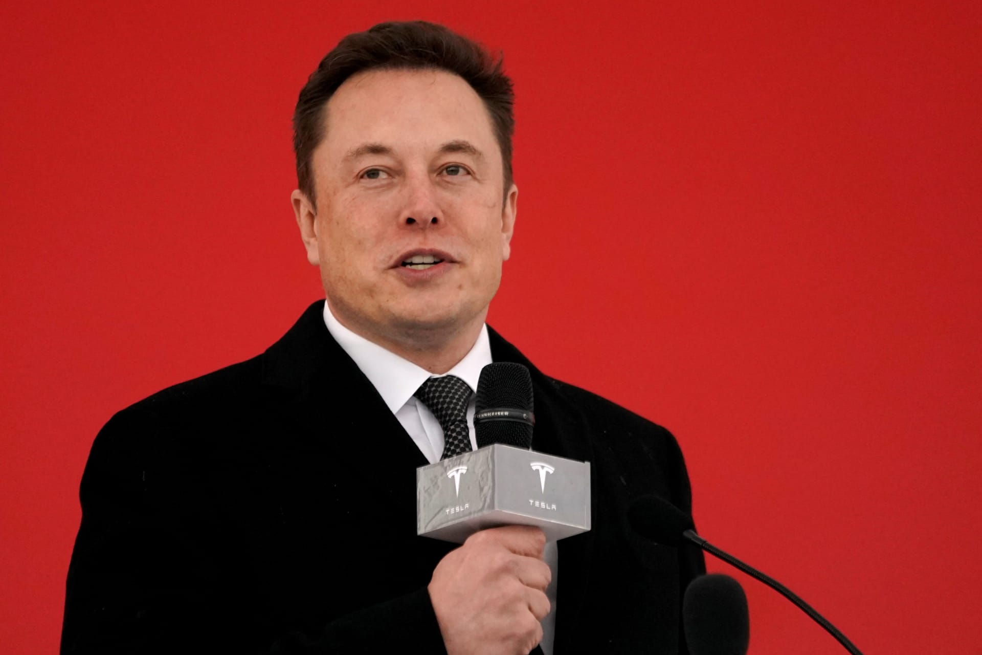 <p>Tesla CEO Elon Musk speaks at the ground breaking ceremony for a Tesla factory in Shanghai in 2019.</p>
